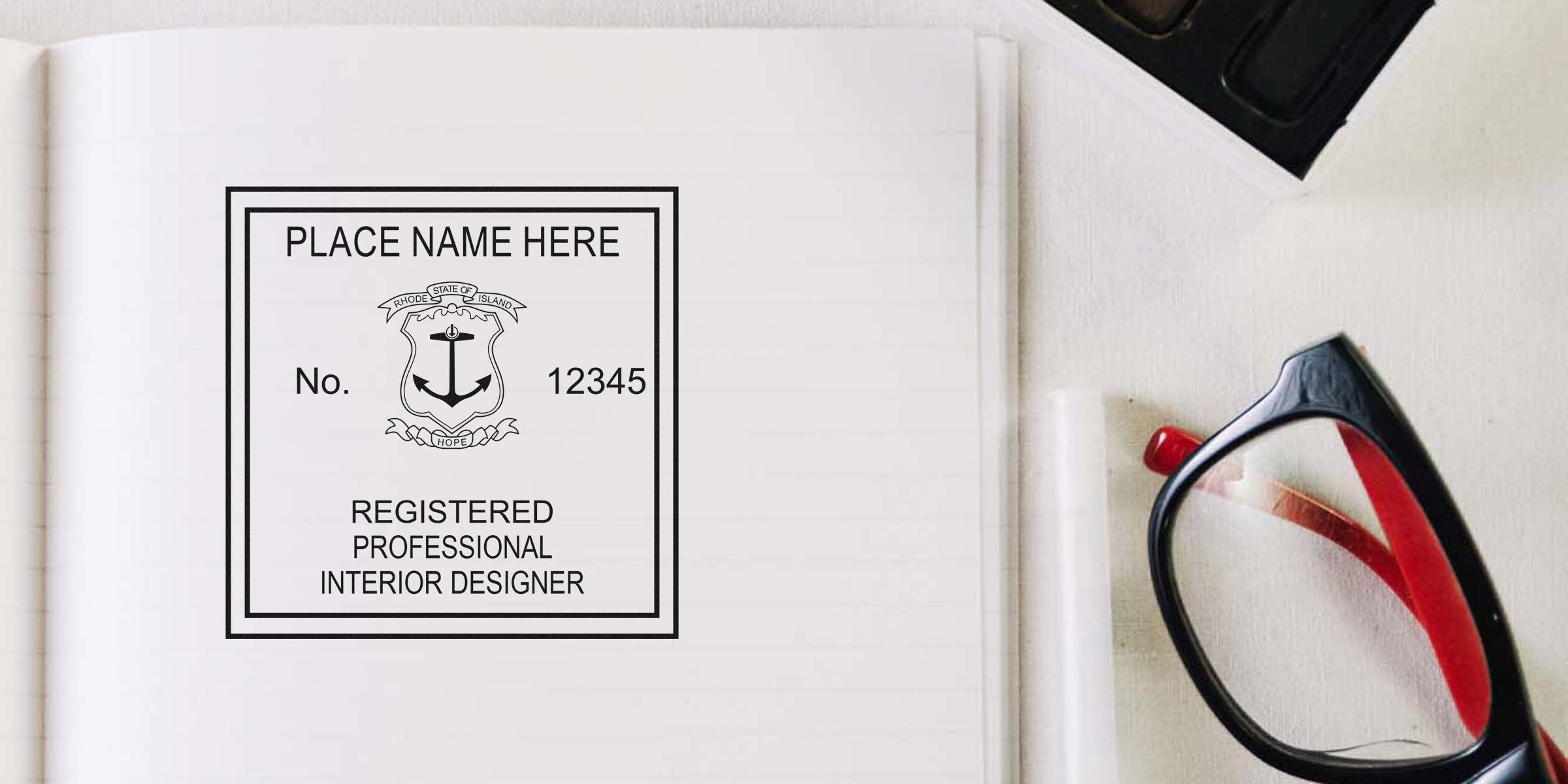 Registered interior designer seal with Rhode Island emblem on notebook page next to black and red glasses, highlighting design certification requirements.
