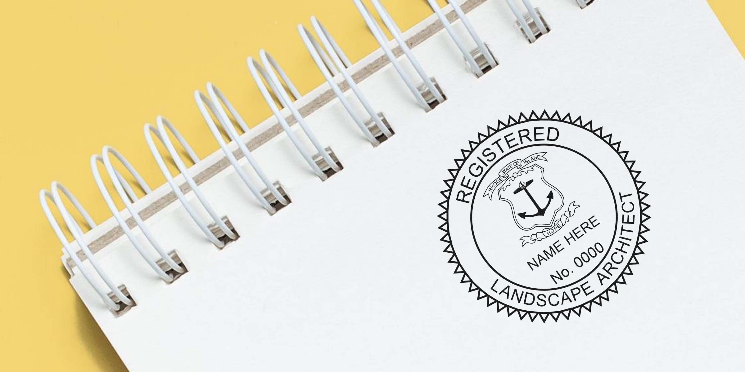 Registered landscape architect stamp from Rhode Island on a white spiral notebook with a yellow background, showcasing Rhode Island landscape architect certification.