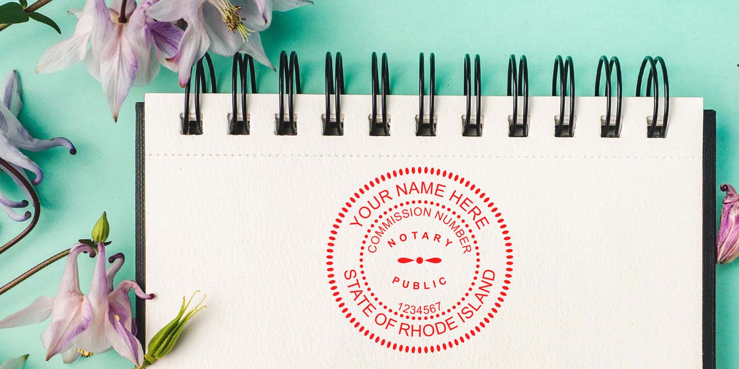 Rhode Island notary stamp on blank notebook with flowers, showing official RI notary commission seal and stamp format sample.