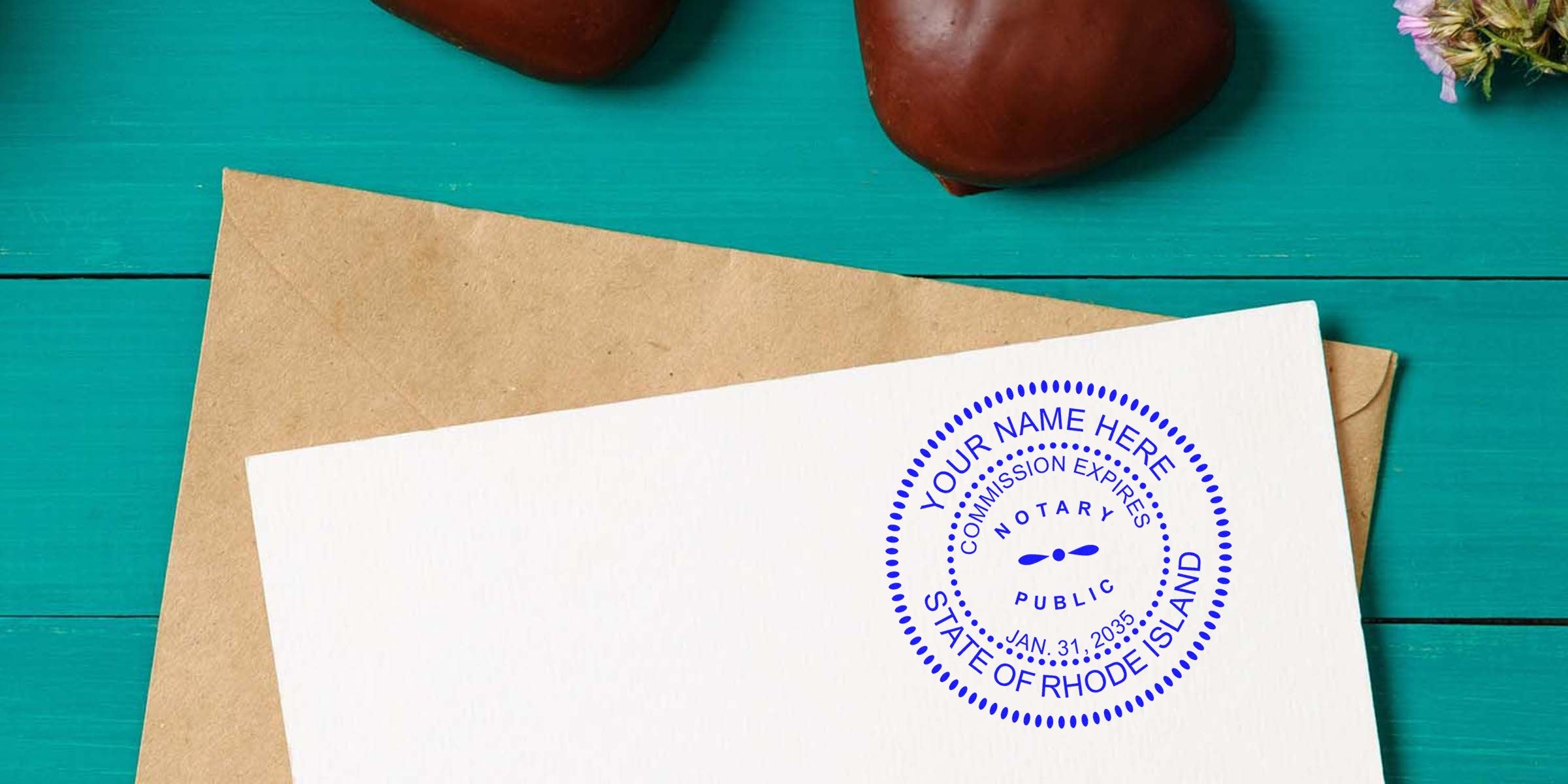 Custom RI notary stamp on white paper with brown envelope on teal wood background, personalized notary seal, essential RI notary tools and supplies.