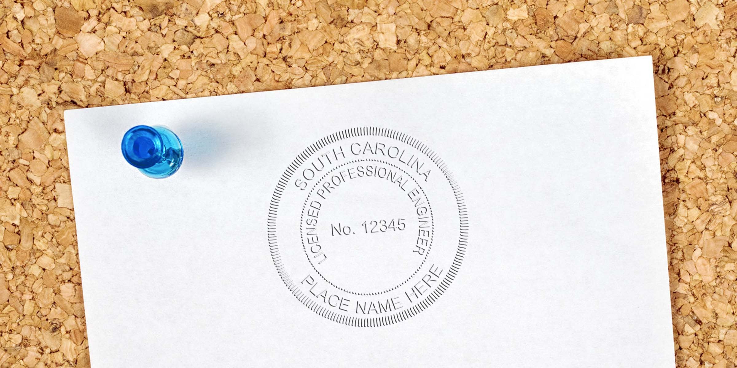 South Carolina licensed professional engineer seal on white paper pinned to corkboard, displaying SC Engineer Stamp size and specifications.