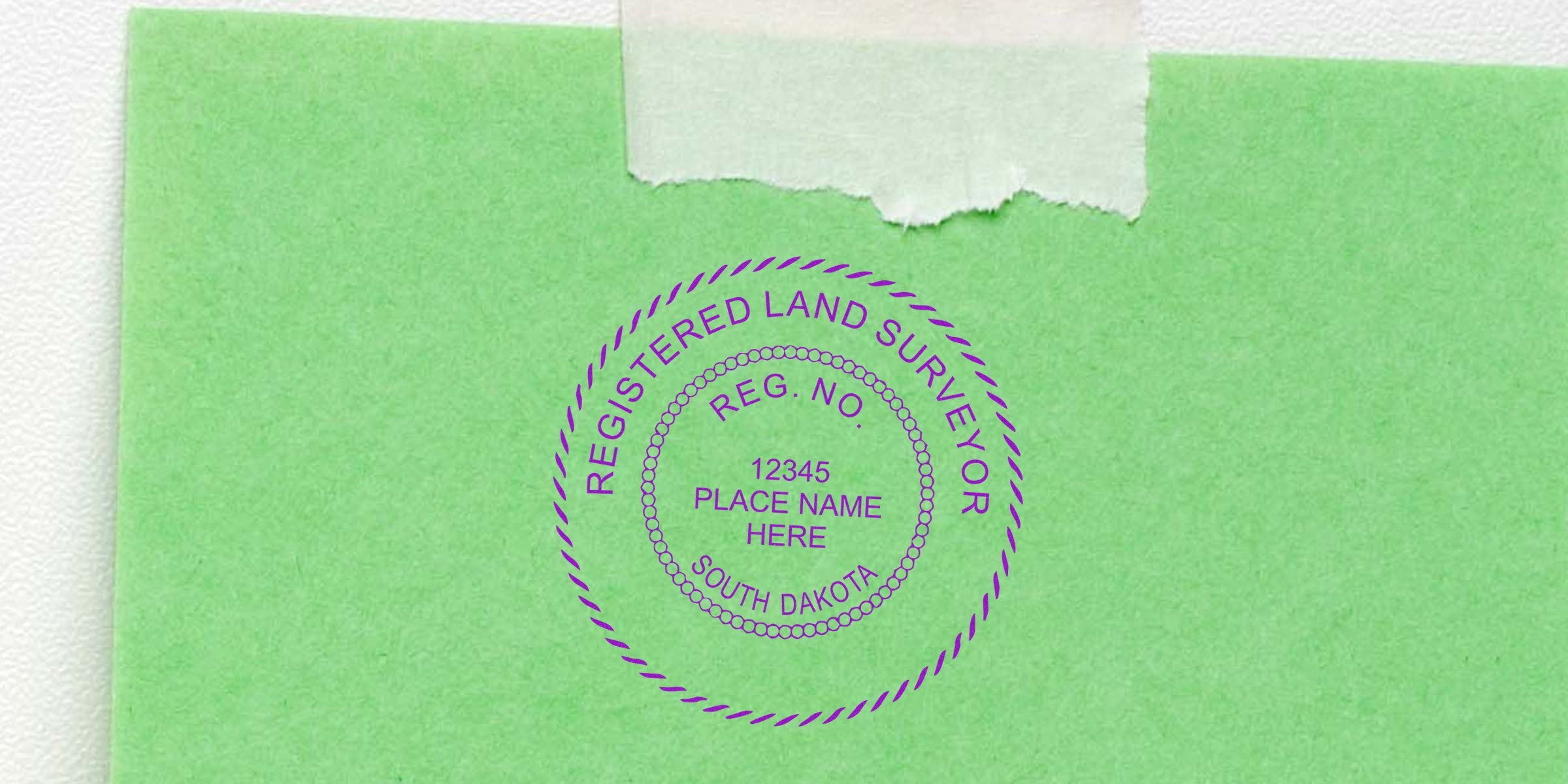 Registered land surveyor stamp on green paper with South Dakota land surveyor seal, designed per South Dakota land surveyor seal guidelines for land surveying services.