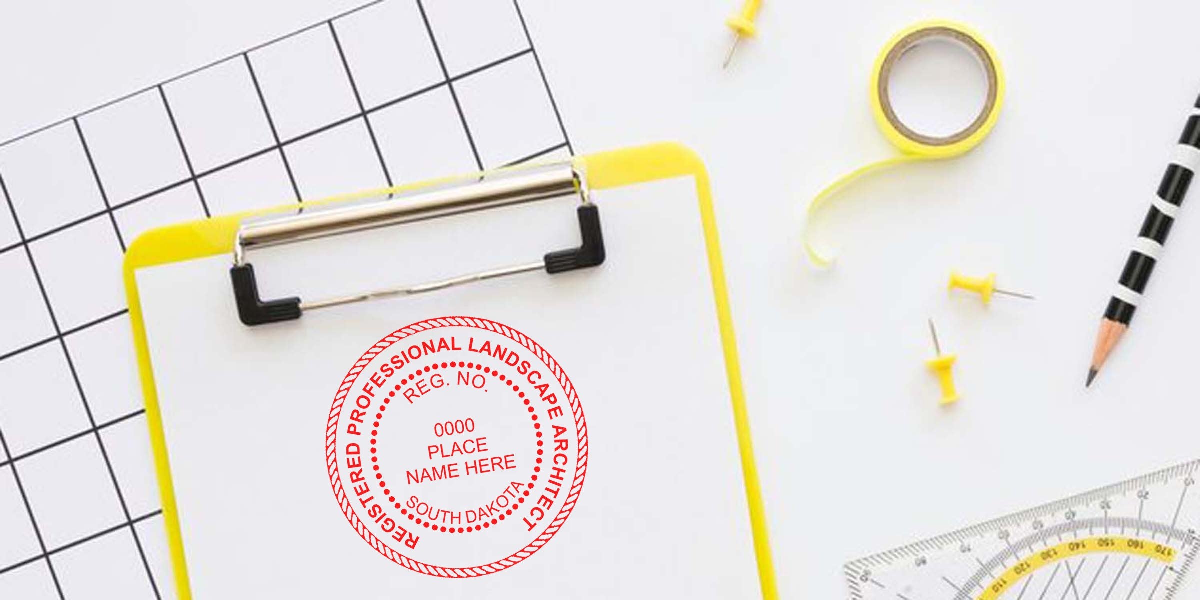 South Dakota landscape architect stamp on clipboard with office supplies for license application and certification.
