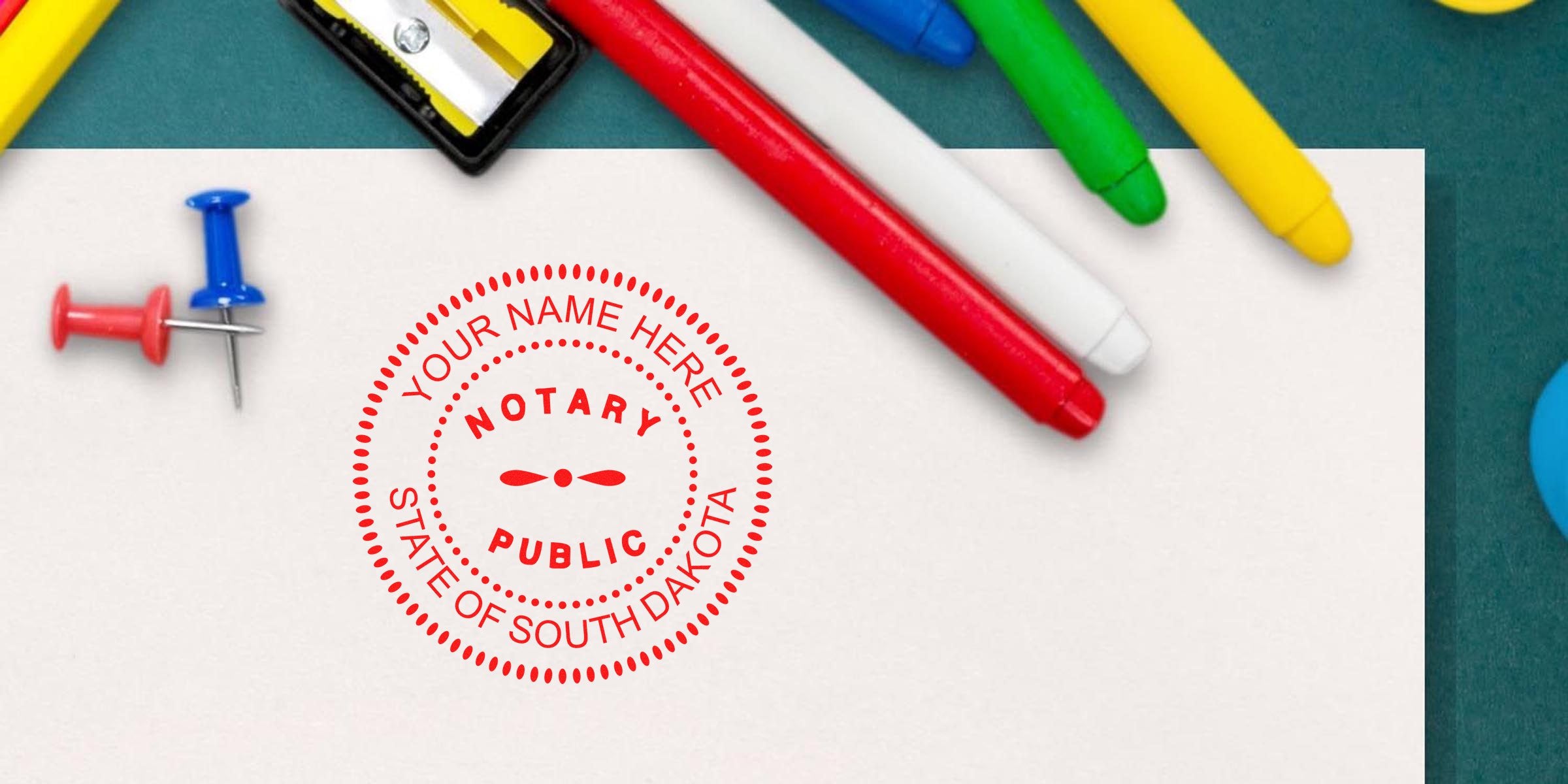 South Dakota notary stamp on paper, surrounded by colorful markers and push pins, highlighting official document certification and notary public tips.