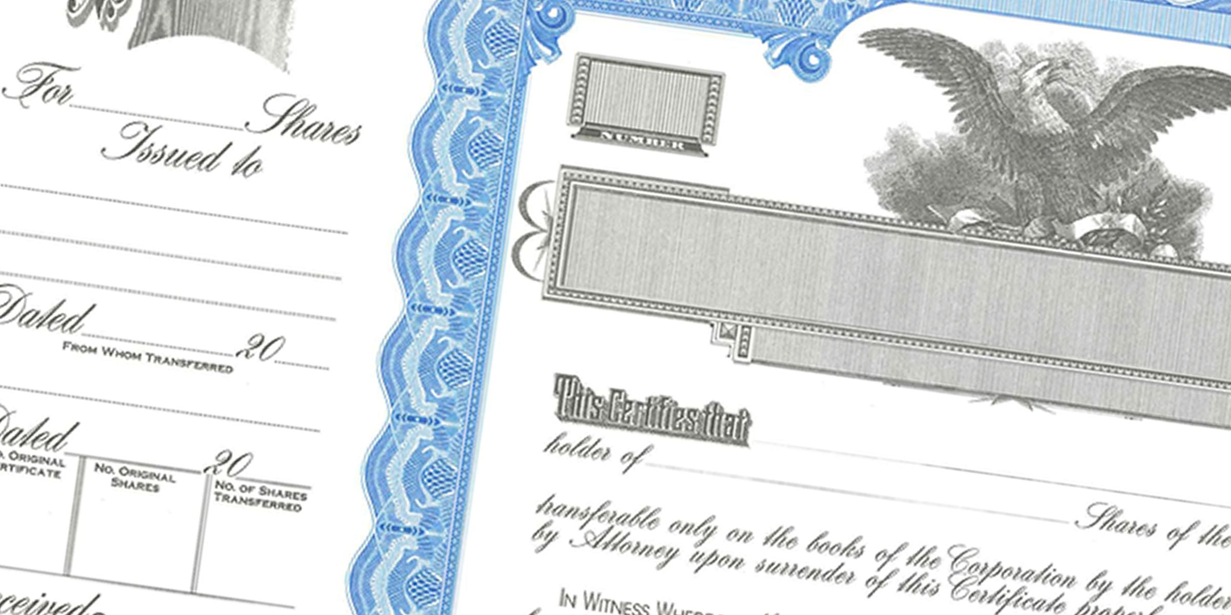 Close-up of an antique stock certificate with blue ornate border, eagle engraving, and handwritten share transfer details