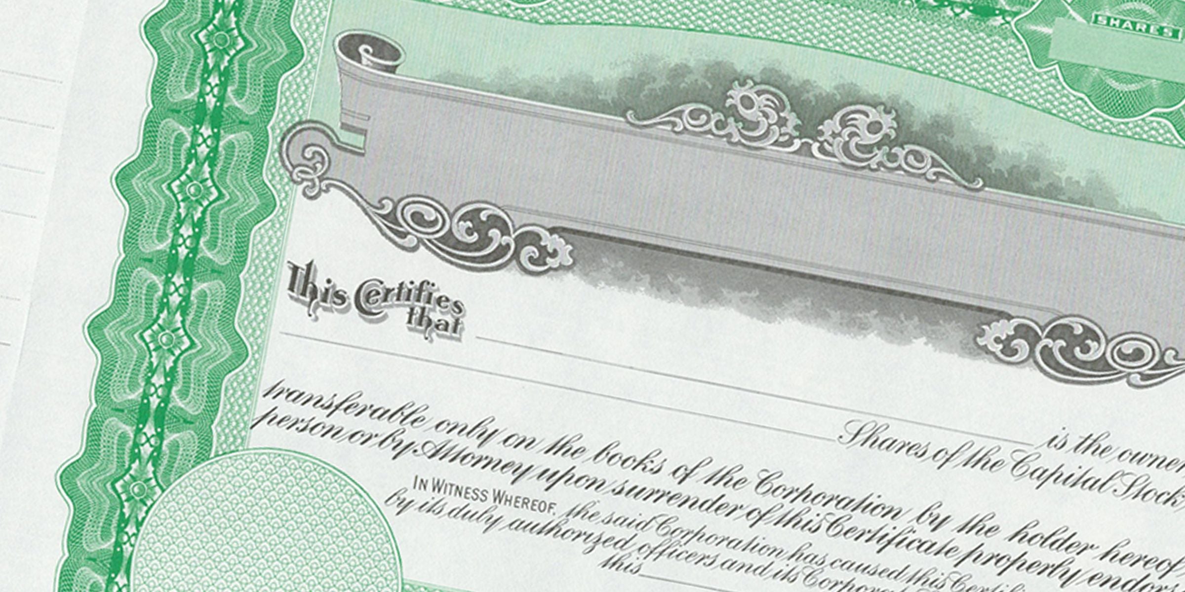 Green blank stock certificate with ornate engraved border, decorative scrollwork, and “This certifies that” text for corporate share ownership.