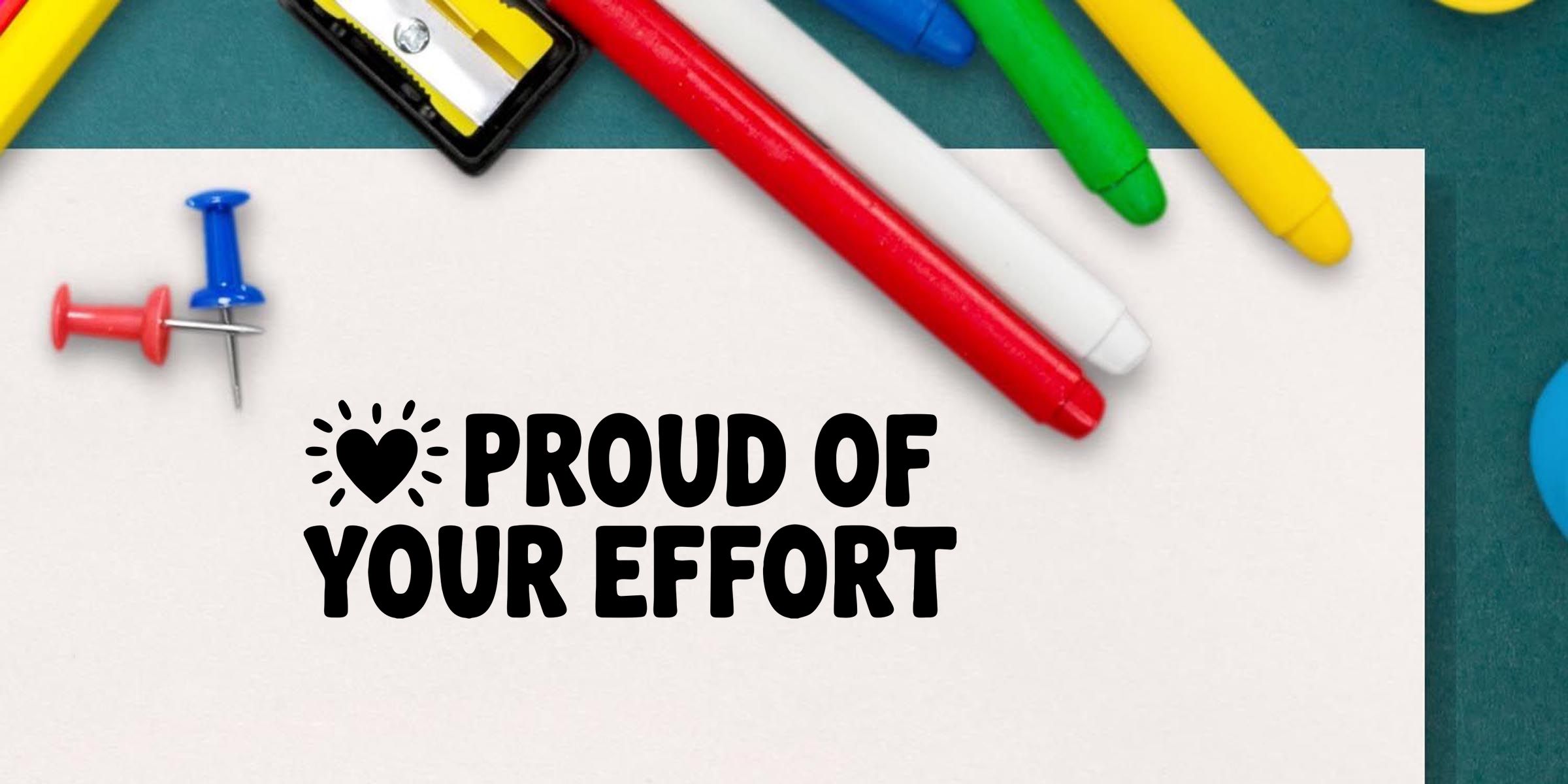Colorful stationery supplies with push pins and pens surrounding a white card that reads “Proud of Your Effort” on a teal background