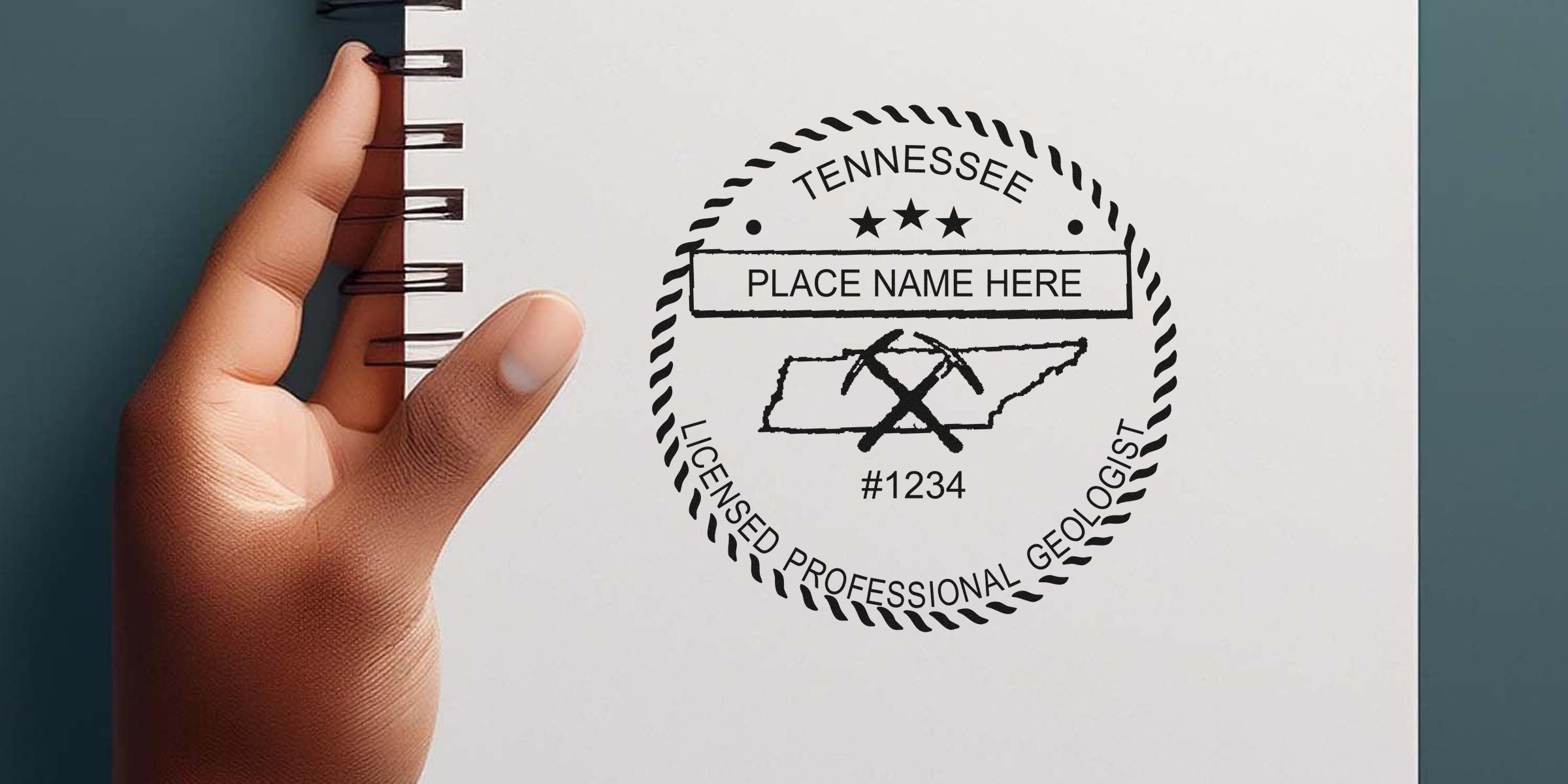 Hand holding a notebook with the Tennessee Professional Geologist Seal and mining tools, highlighting Tennessee Geologist Seal requirements.