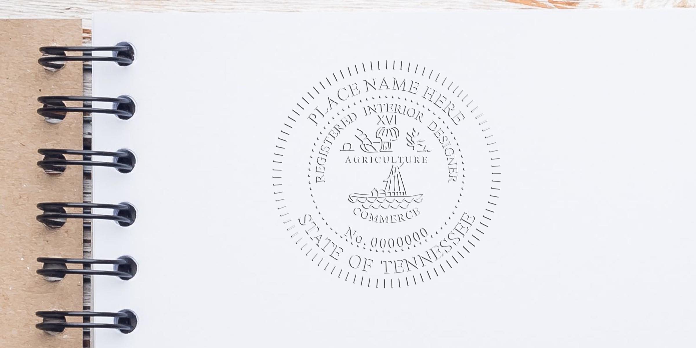 Custom embossed seal on white paper with spiral binding for Tennessee interior designer license and stamp renewal tips.