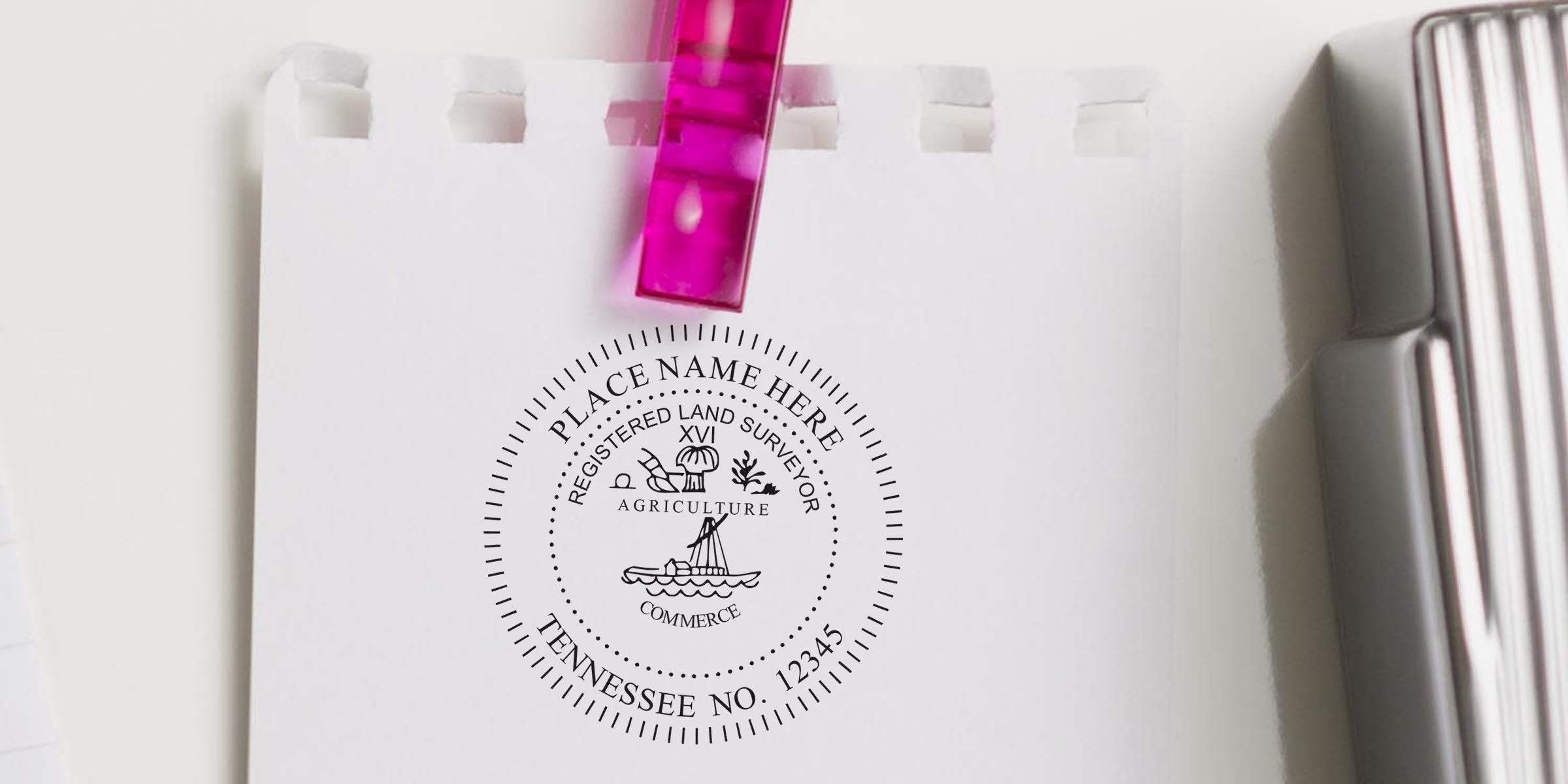 Tennessee land surveyor stamp on white paper with agriculture and commerce symbols, featuring the Tennessee land survey seal and land surveyor certification.