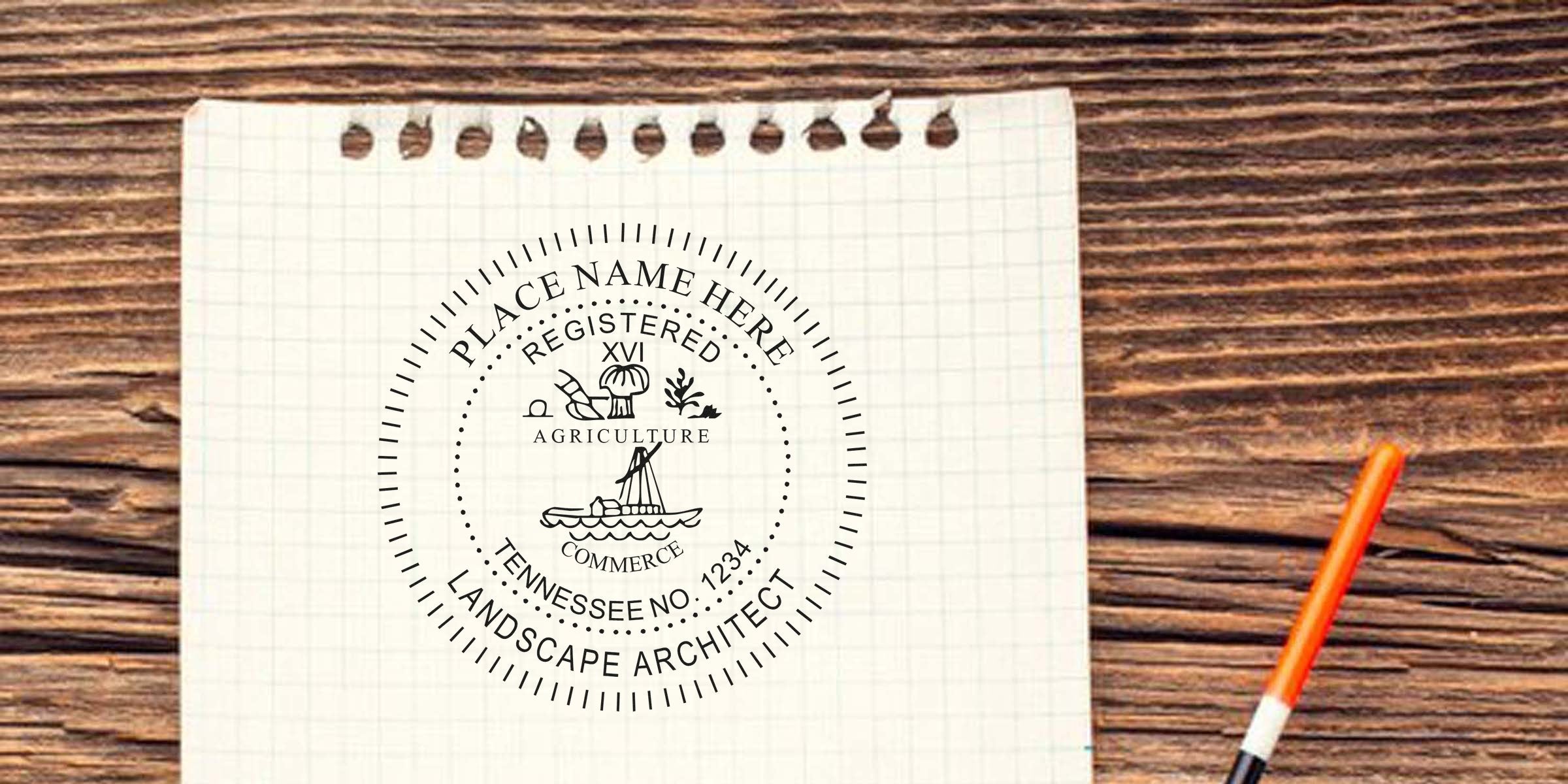 Custom Tennessee landscape architect seal on grid paper with agriculture and commerce icons, on wooden table with orange pen, following Tennessee landscape architect guidelines.