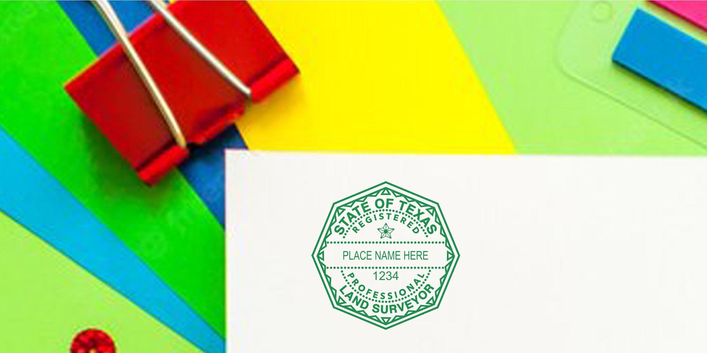 Texas land surveyor stamp on white paper with colorful office supplies, showing stamp size and meeting Texas land surveyor stamp requirements.