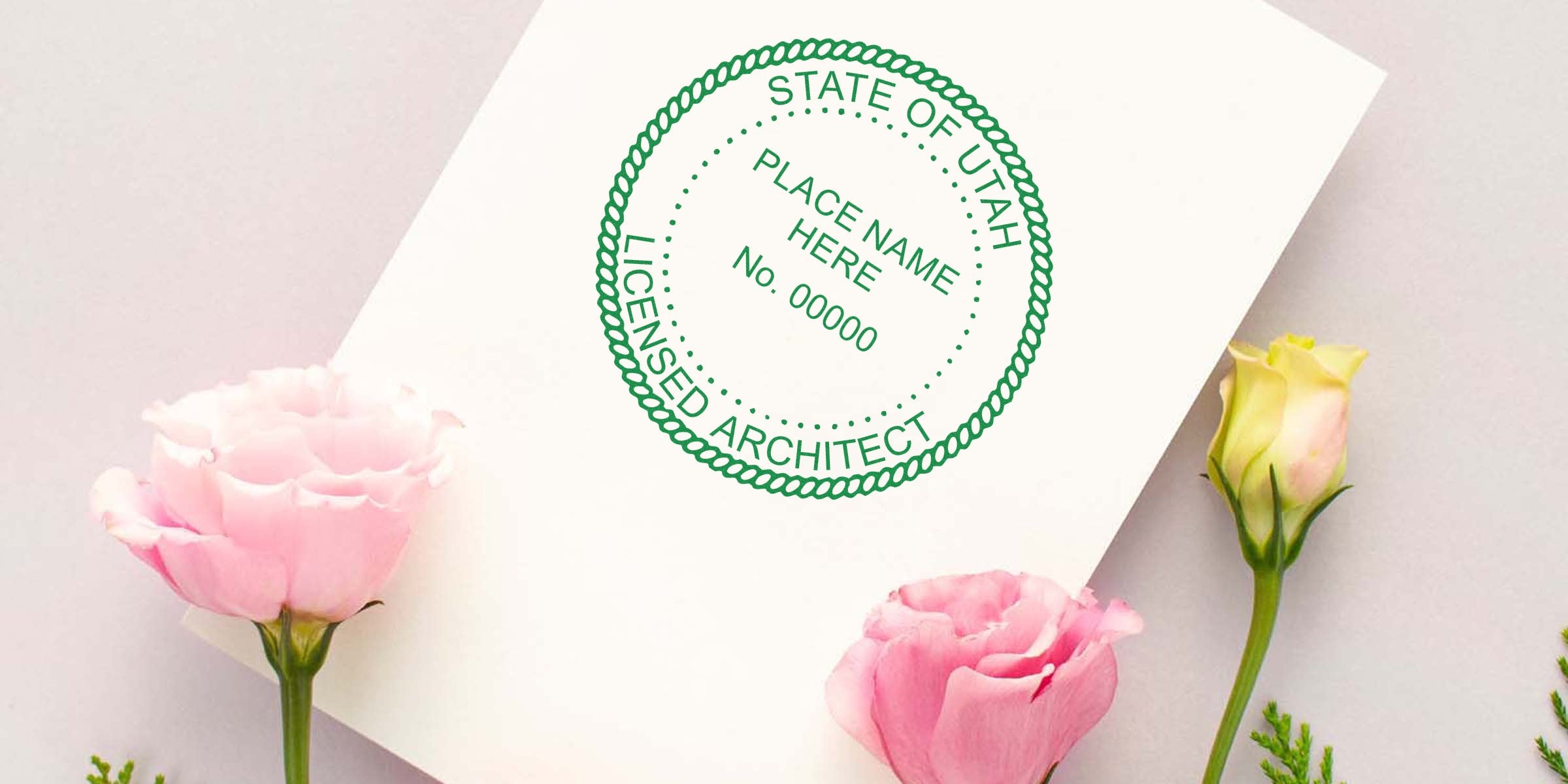 Utah licensed architect custom seal on white paper with pink and yellow flowers, showcasing architect stamp options for certification and licensing in Utah.