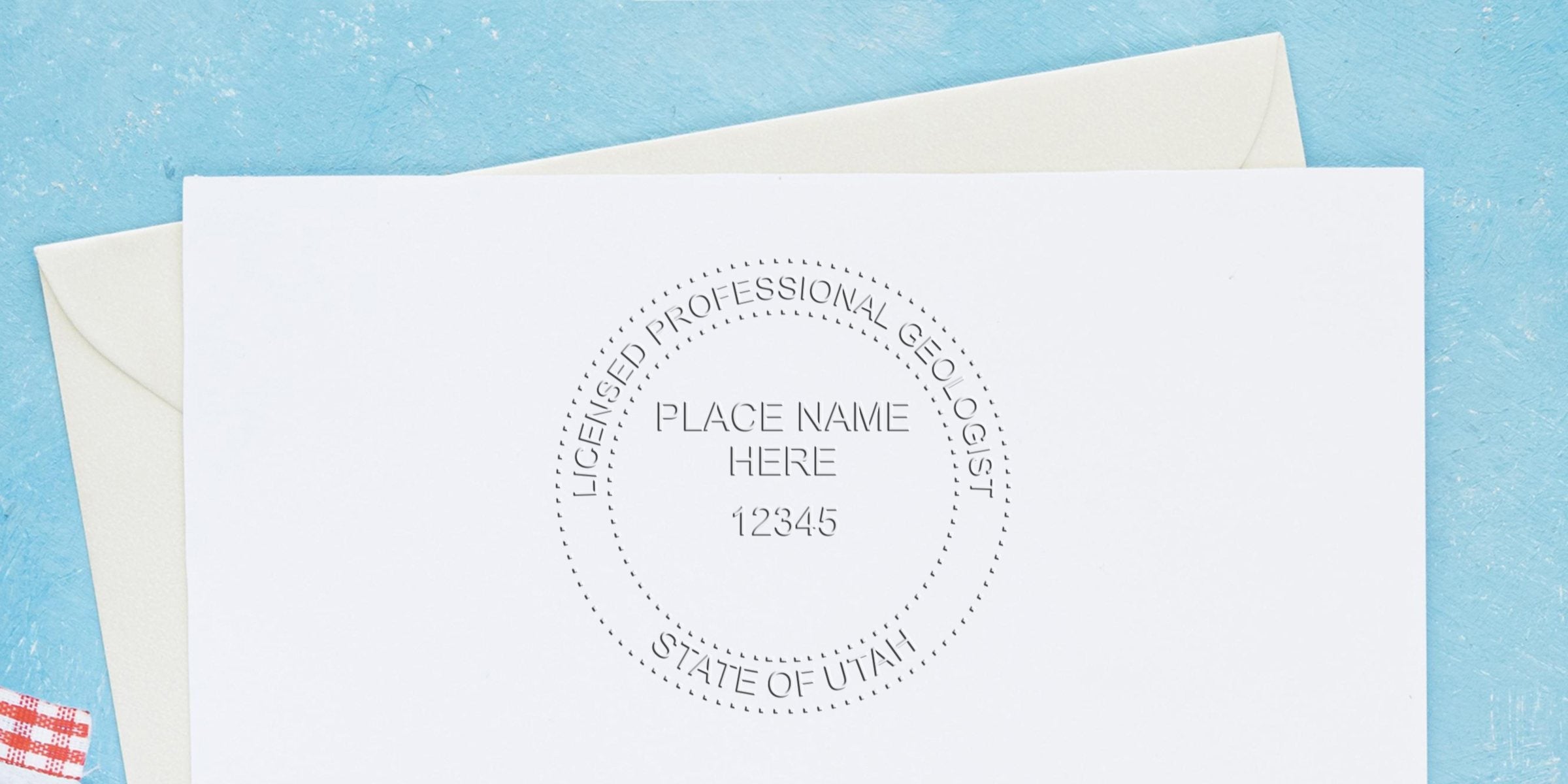 Utah professional geologist seal embossed on white paper with envelope on blue background, showcasing the advantages of the geologist seal.
