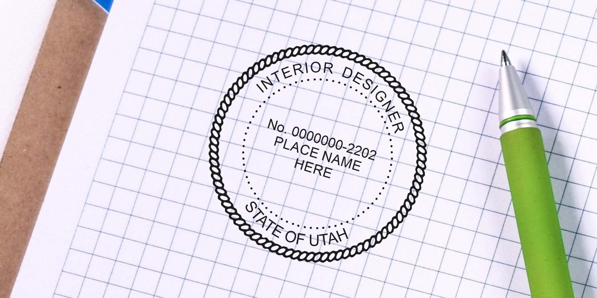 Utah interior designer certification stamp on graph paper with green pen, highlighting seal embosser choice.