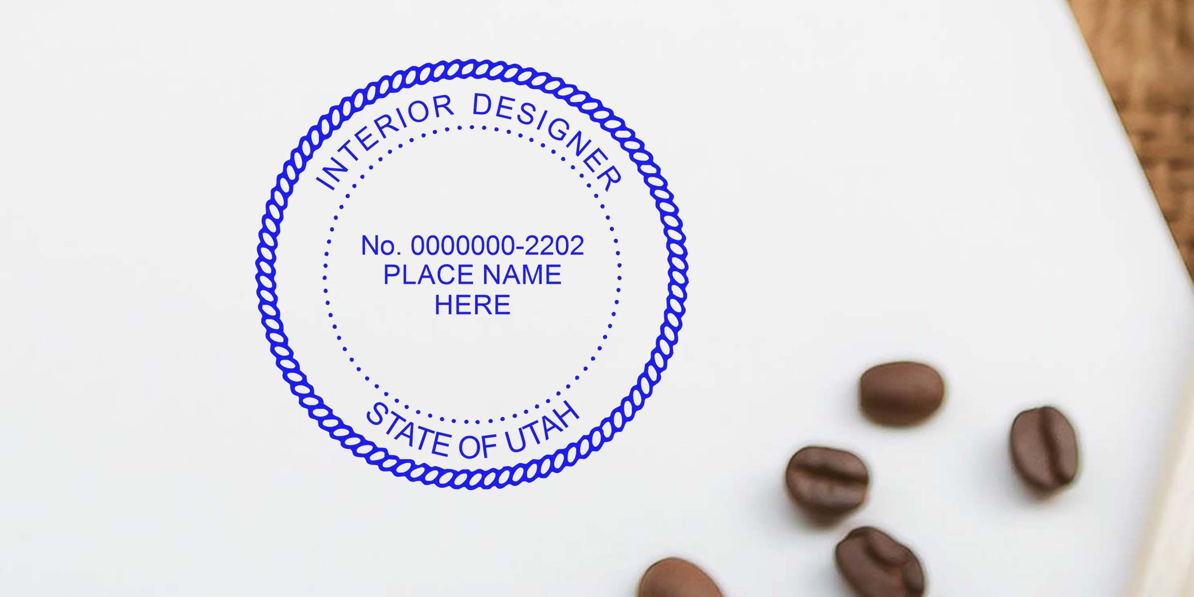 Interior designer stamp on white paper with coffee beans, showing Utah interior design regulations and stamp rules.