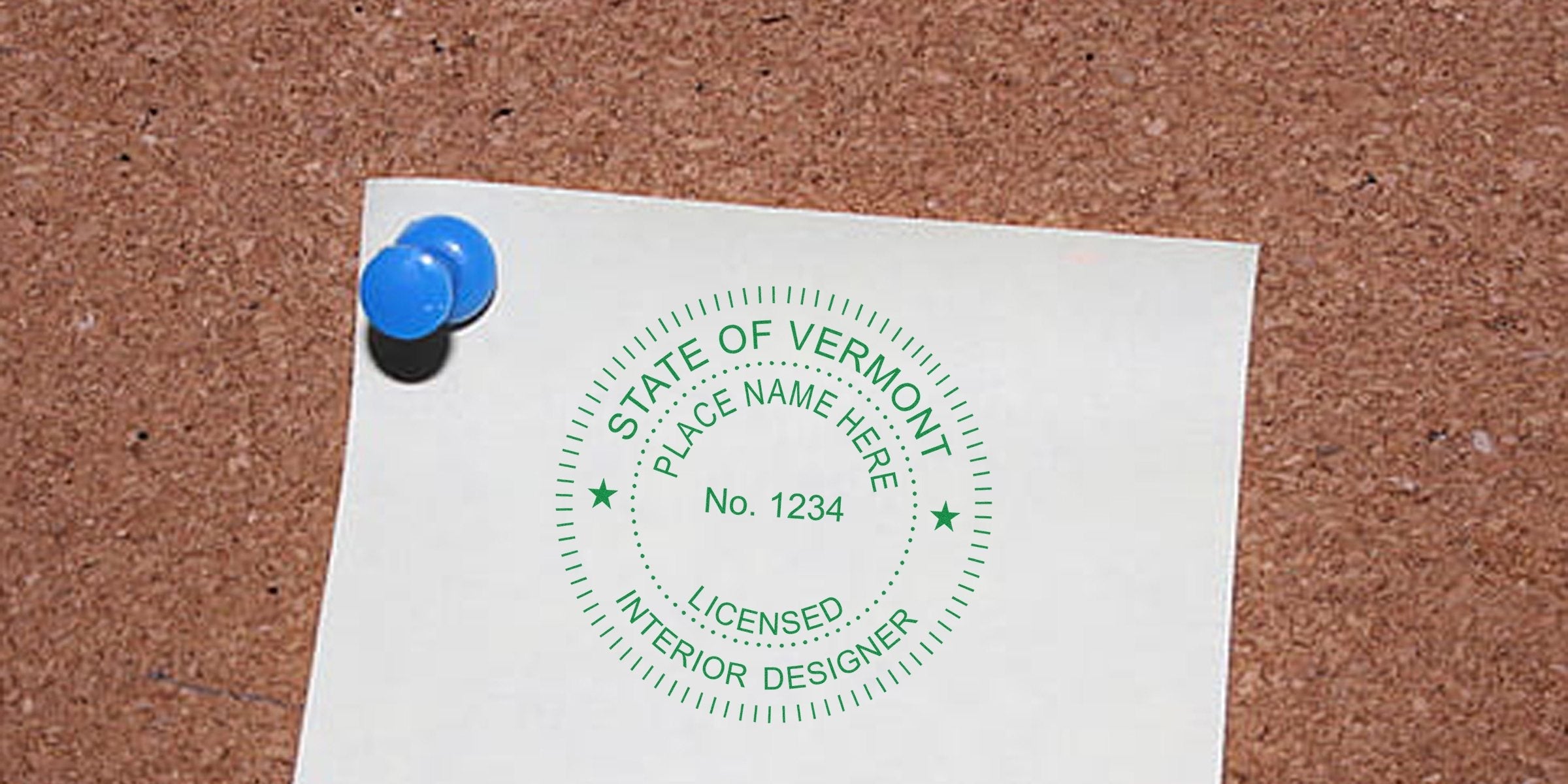 Licensed interior designer stamp on cork board highlighting Vermont interior design regulations and licensing requirements.