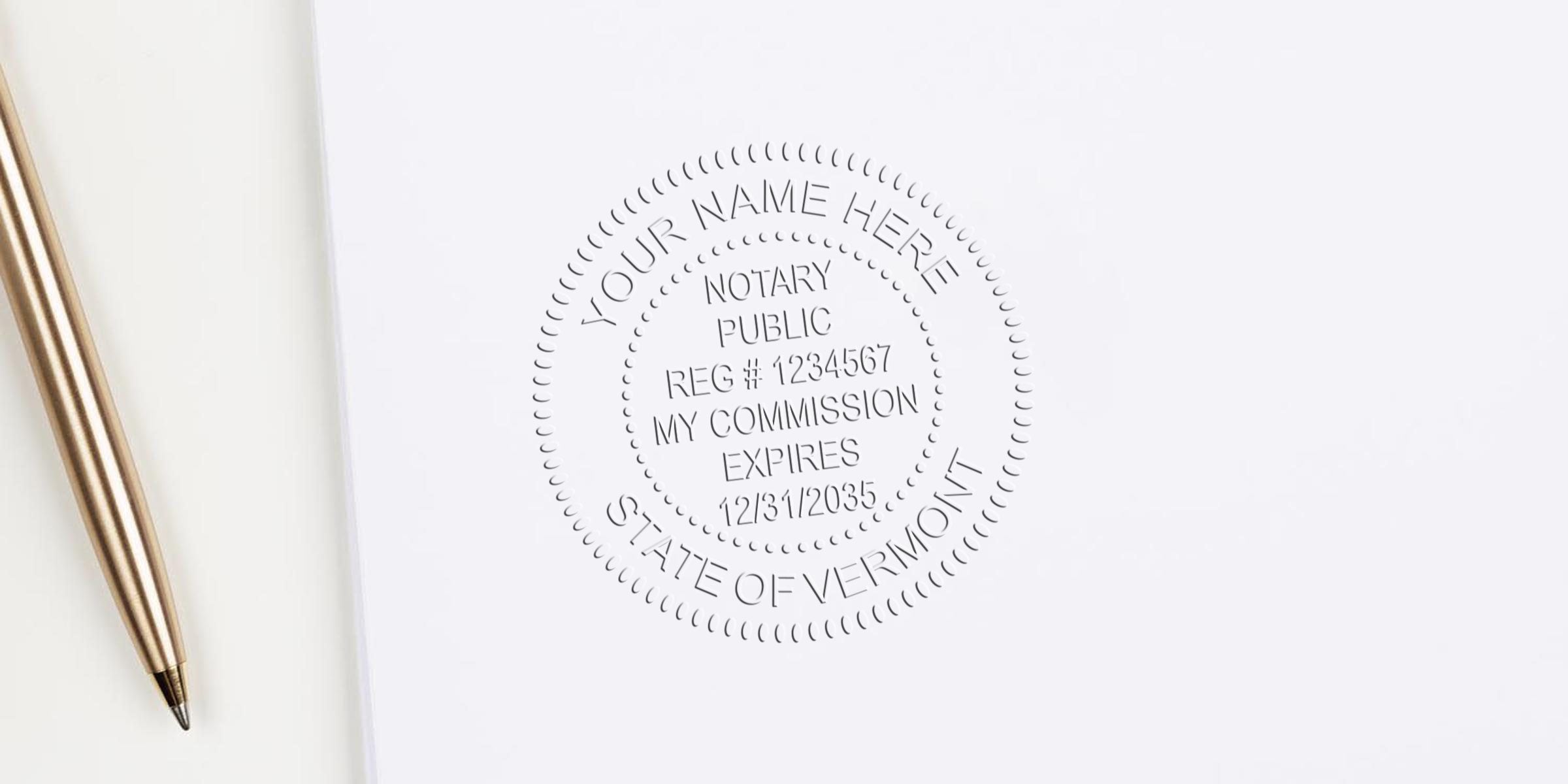 VT notary stamp embossed on white paper with a gold pen, showcasing Vermont notary supplies.