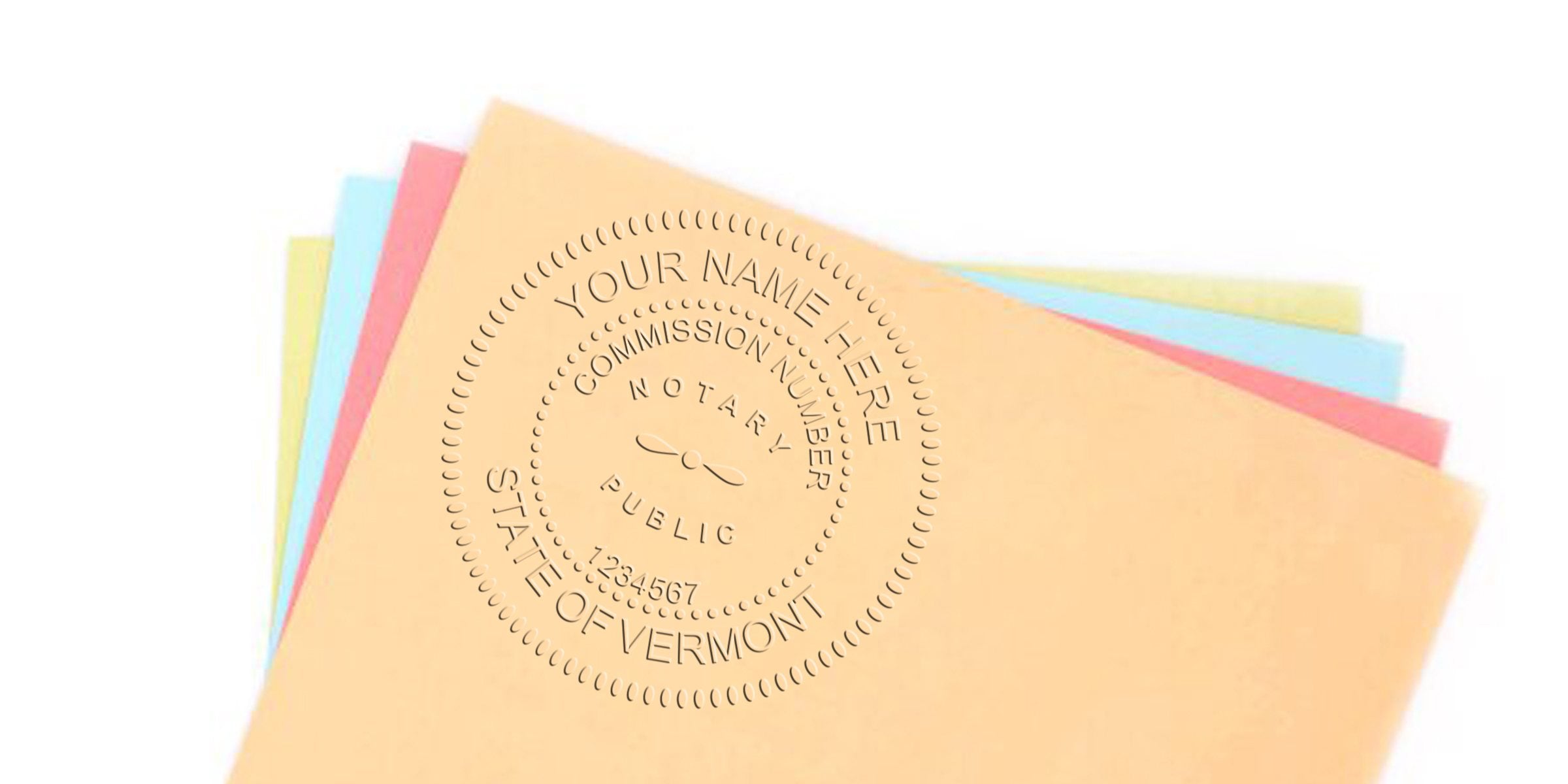 Vermont notary stamp embossed on colorful paper, showing requirements for Vermont notary commission.