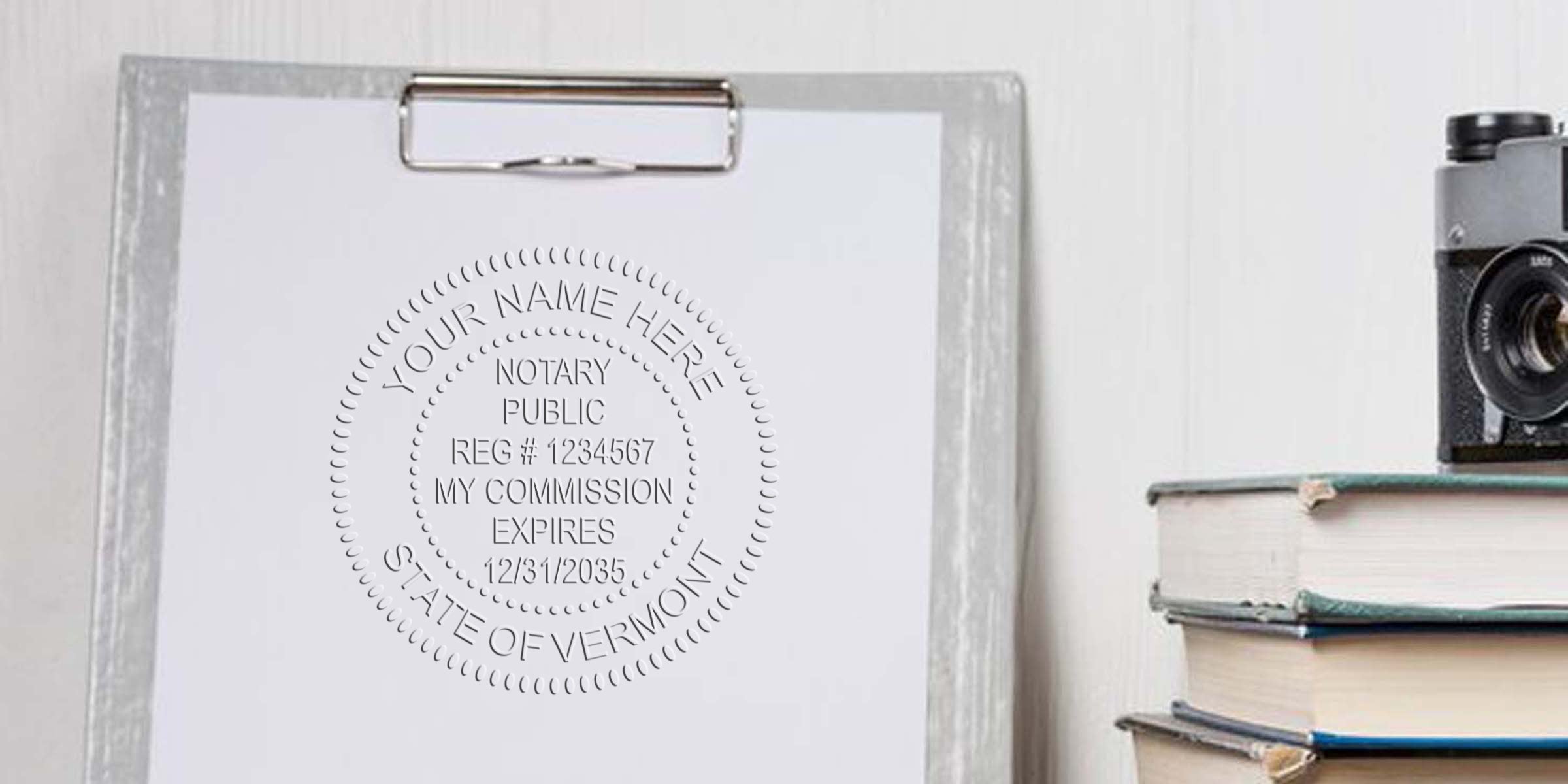 Embossed Vermont notary seal on white paper with vintage camera and books, showing Vermont notary seal and its requirements.