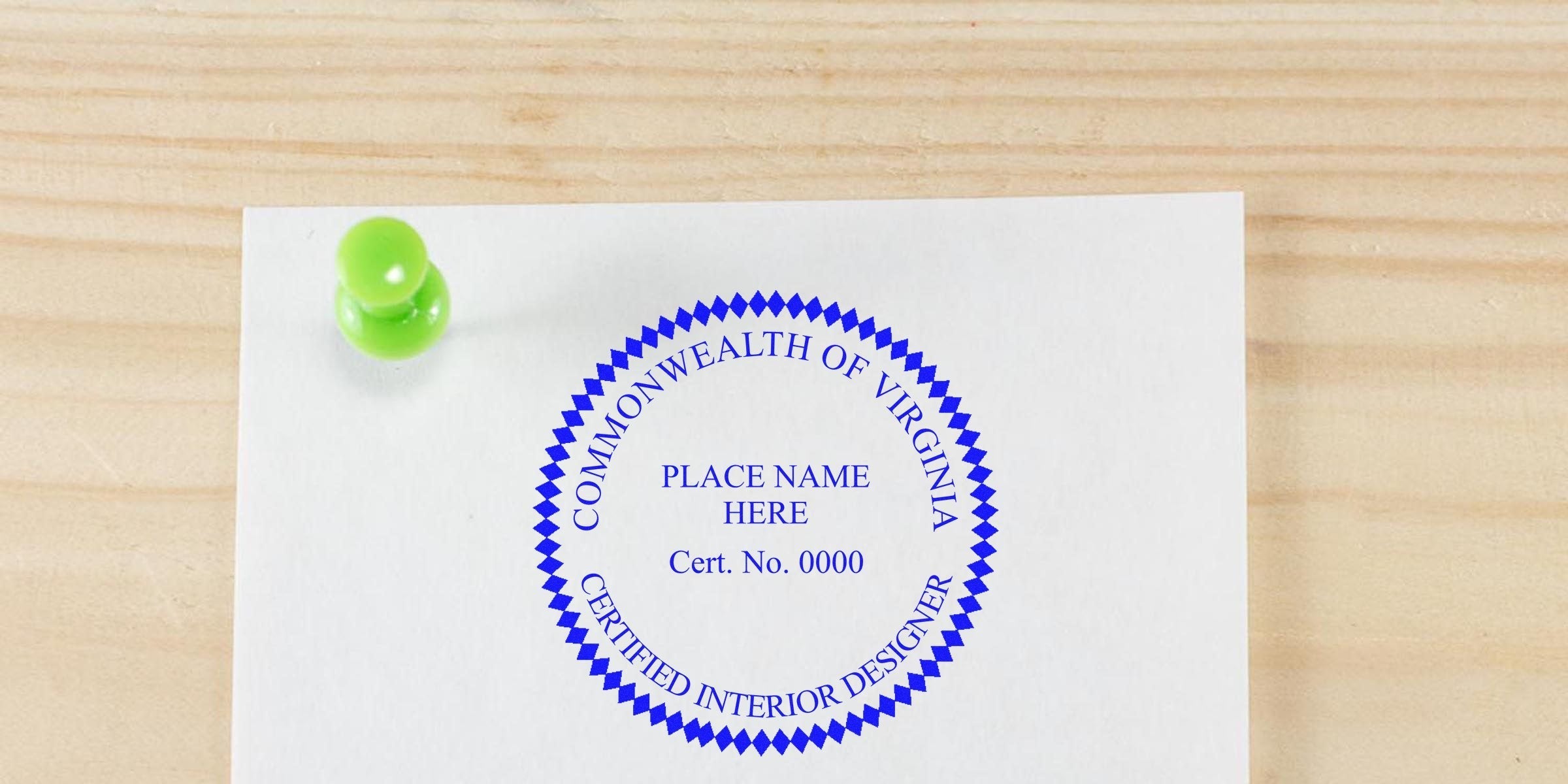 Virginia interior designer seal application pinned with a green pushpin on a wooden surface.