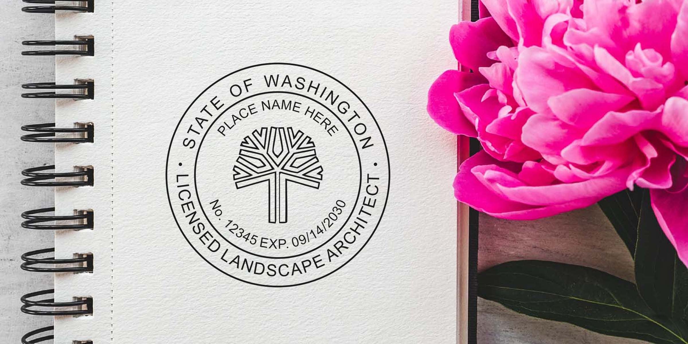 Washington landscape architect stamp on notebook with pink flower, showing licensed architect seal and online certification.