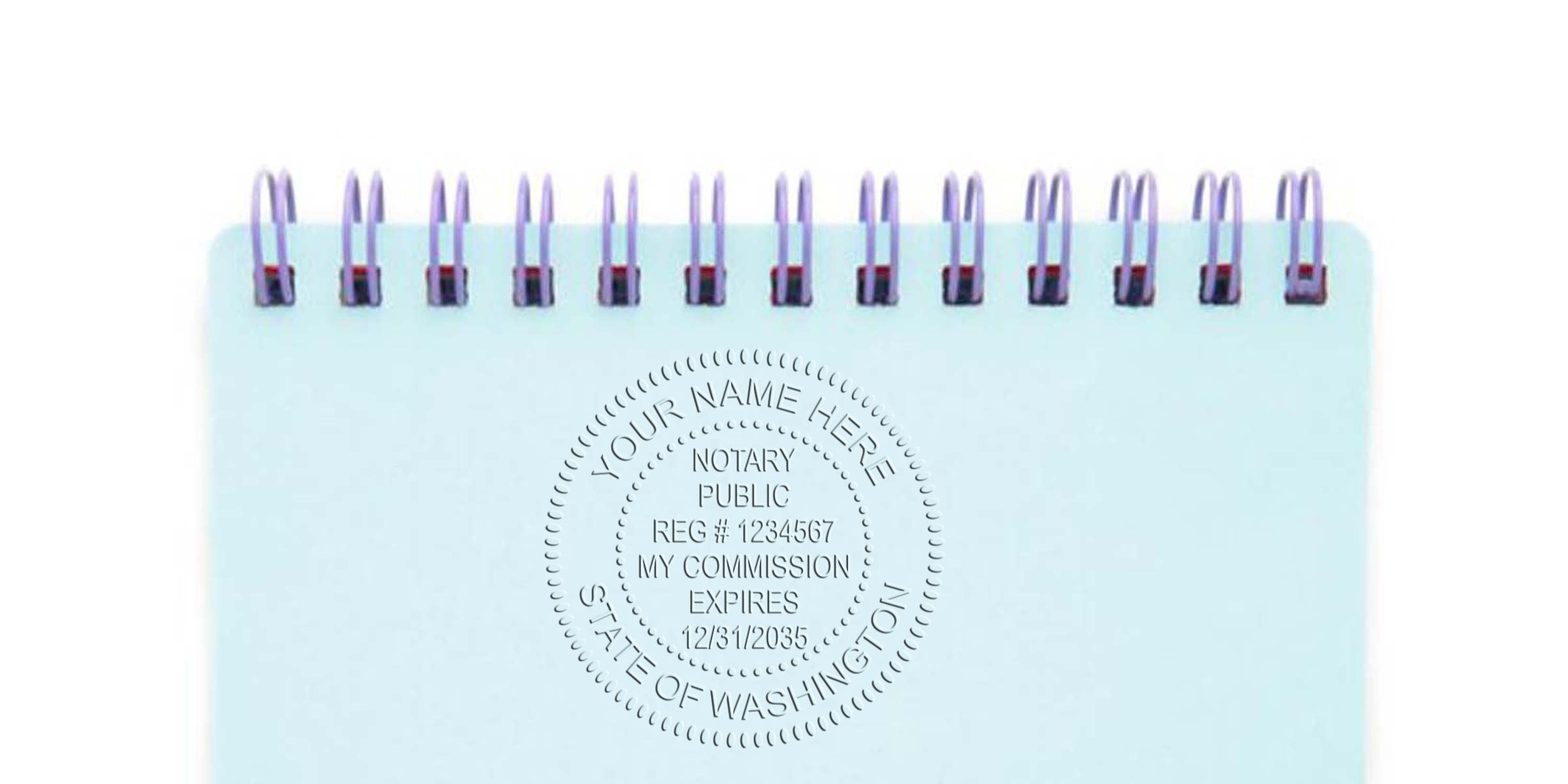 Washington notary stamp embossed on blue spiral notebook, showing official document authentication with notary seal details.