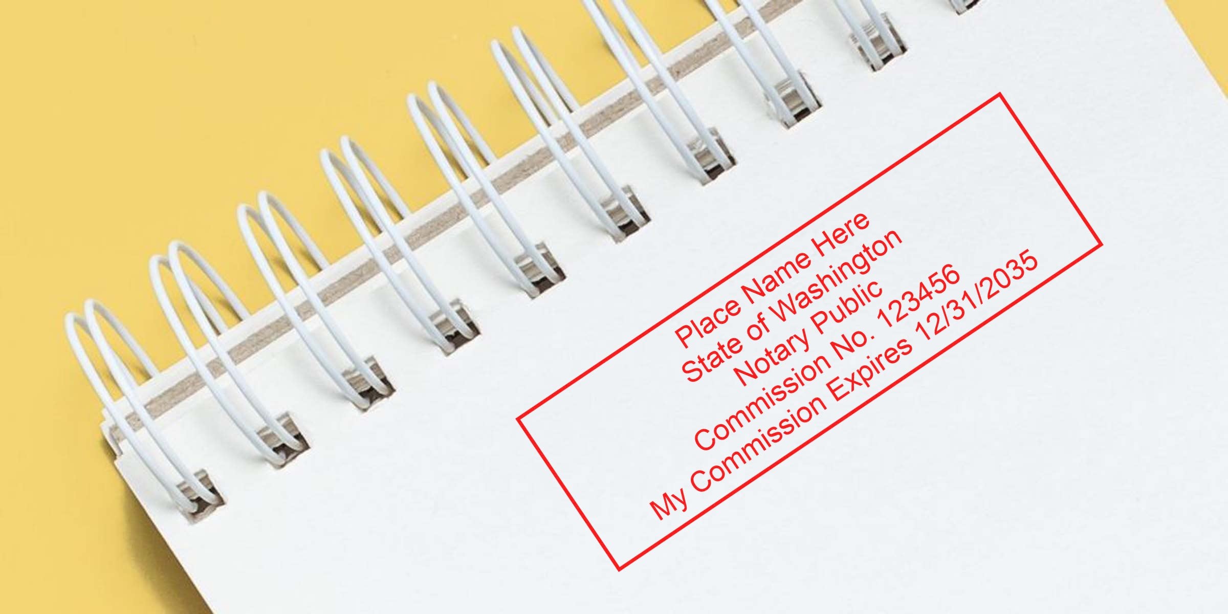 Spiral notebook showing Washington notary seal on a yellow background.