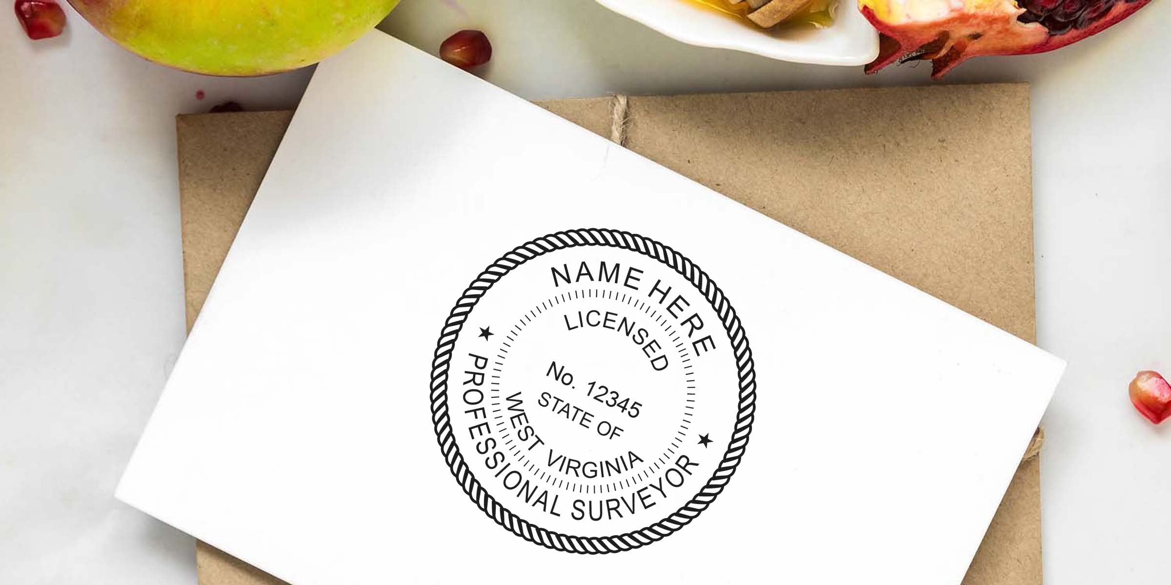 West Virginia land surveyor stamp on white envelope with apple and pomegranate background, highlighting WV land surveyor requirements.