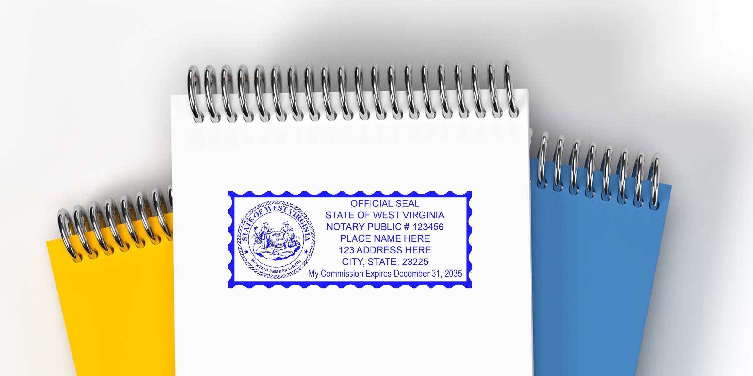 West Virginia notary public seal stamp on white spiral notebook, with yellow and blue notebooks behind, displaying seal dimensions and size requirements.