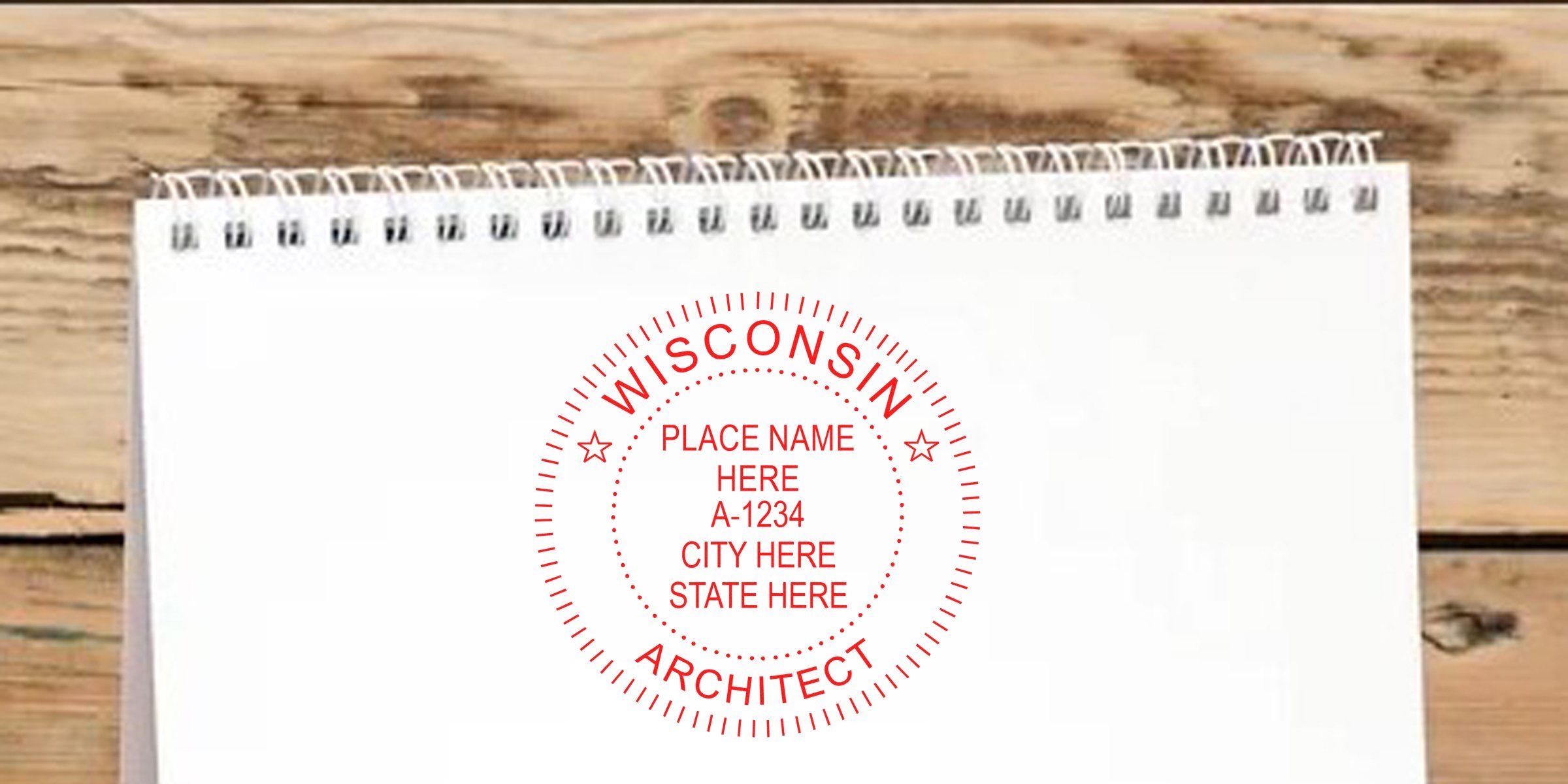 White spiral notebook with Wisconsin architect stamp design and seal requirements, placed on a wooden background.