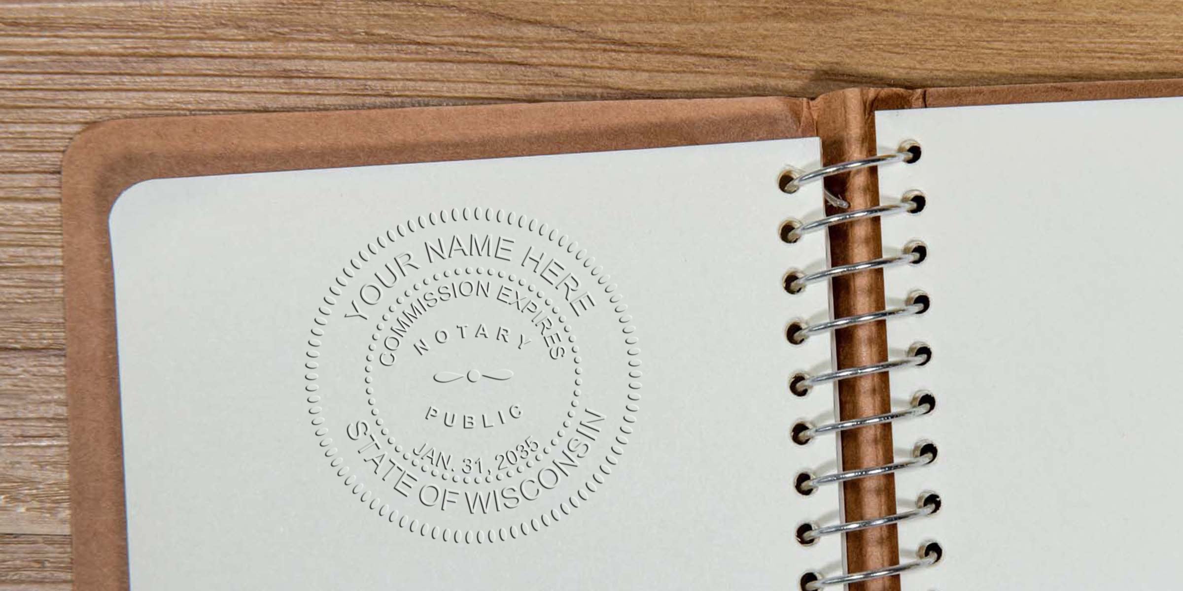 Notary public embossing stamp on notebook page with Wisconsin commission expiration date, part of Wisconsin notary kit and supplies.