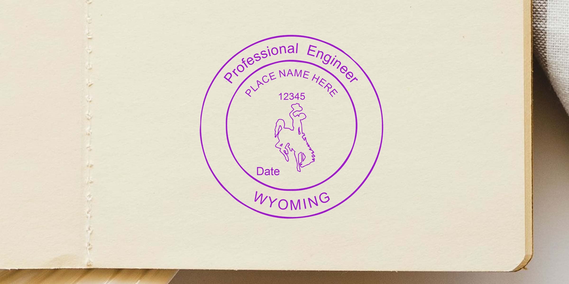 Wyoming PE stamp with professional engineer design and bucking horse logo on cream paper, compliant with PE stamp standards.