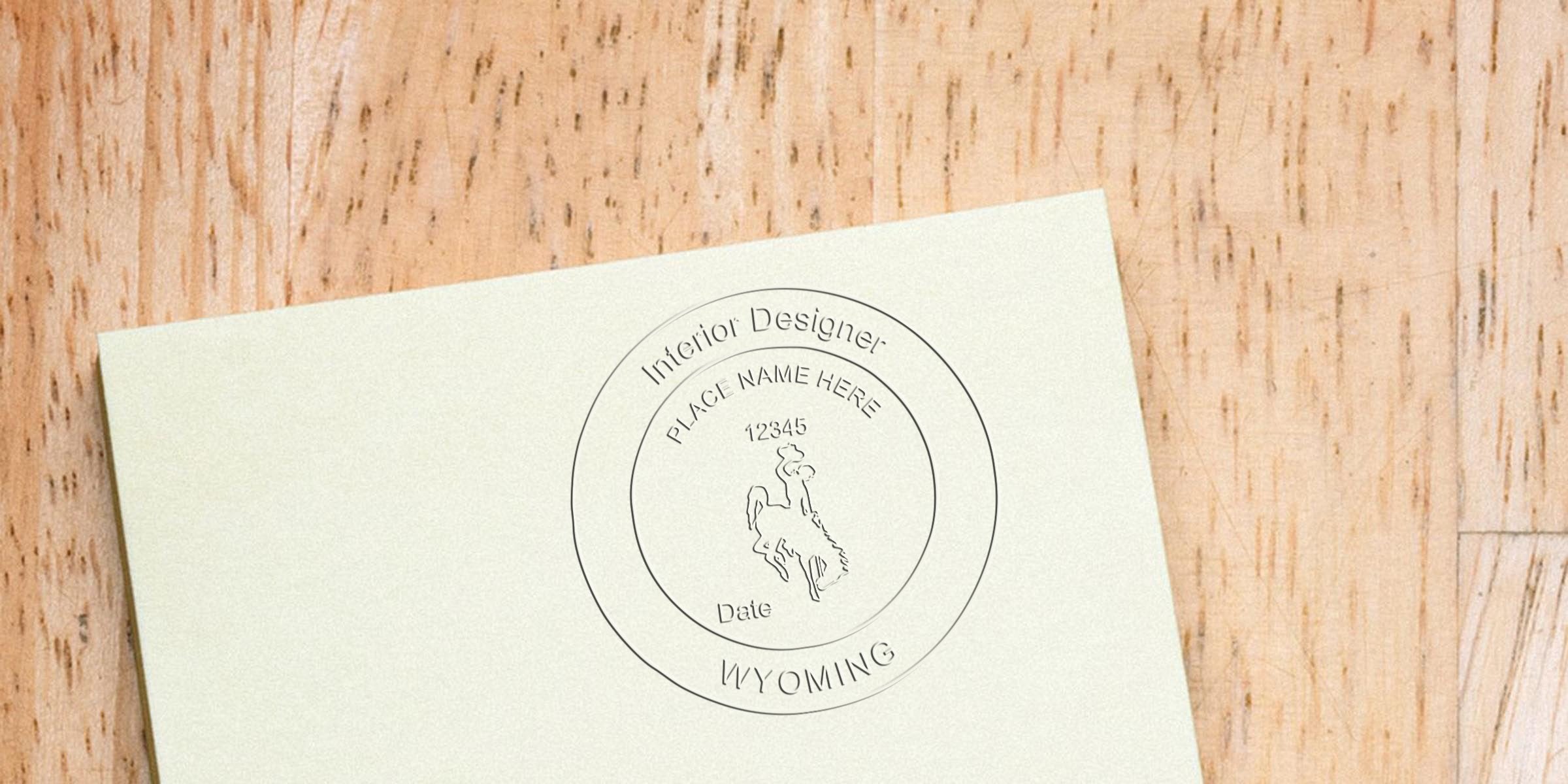 Custom Wyoming interior design license stamp on paper with cowboy logo, meets Wyoming stamp requirements, editable text included.