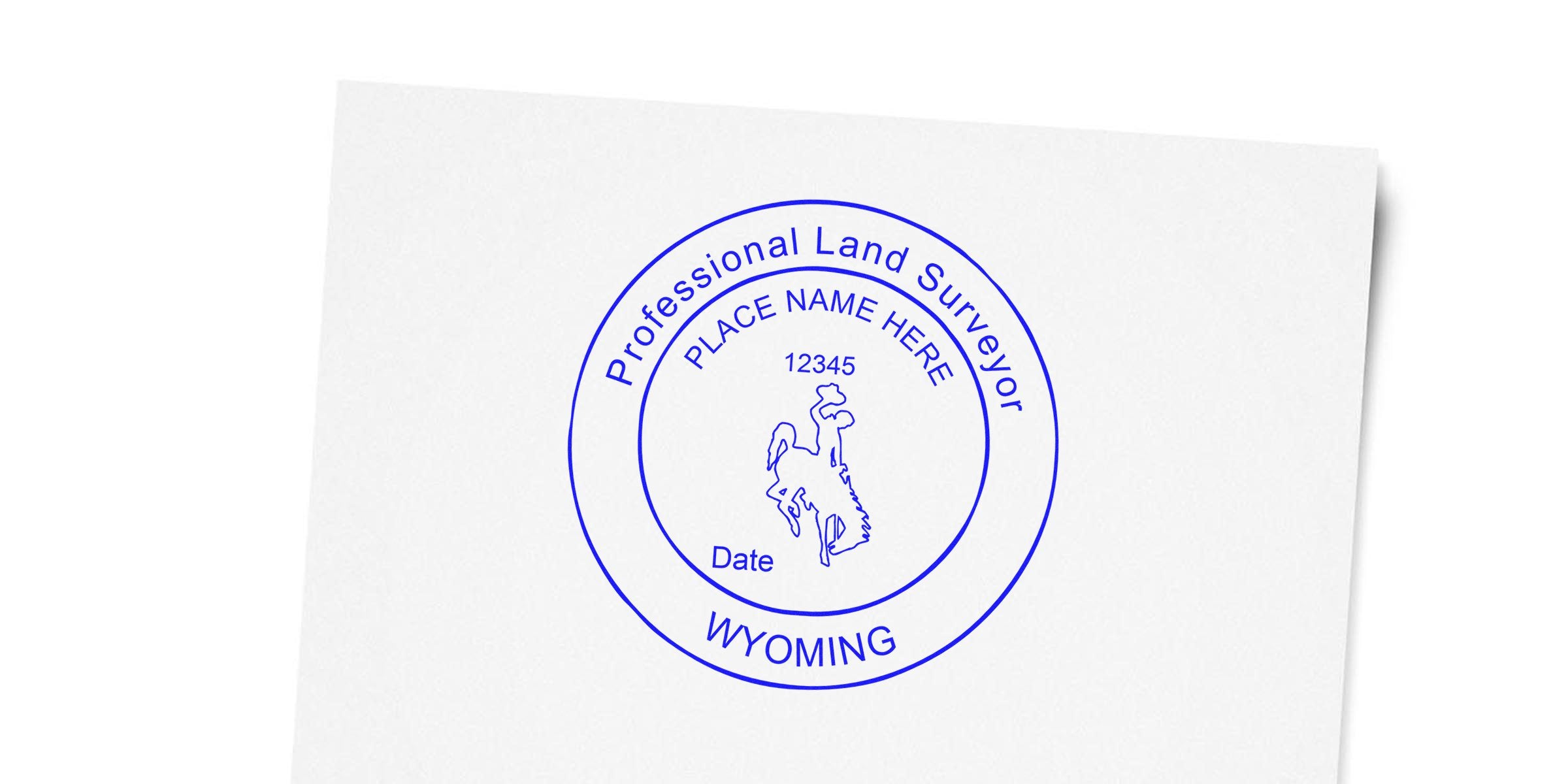 Wyoming land surveyor seal with a cowboy logo and place name, designed as a professional embosser stamp guide.