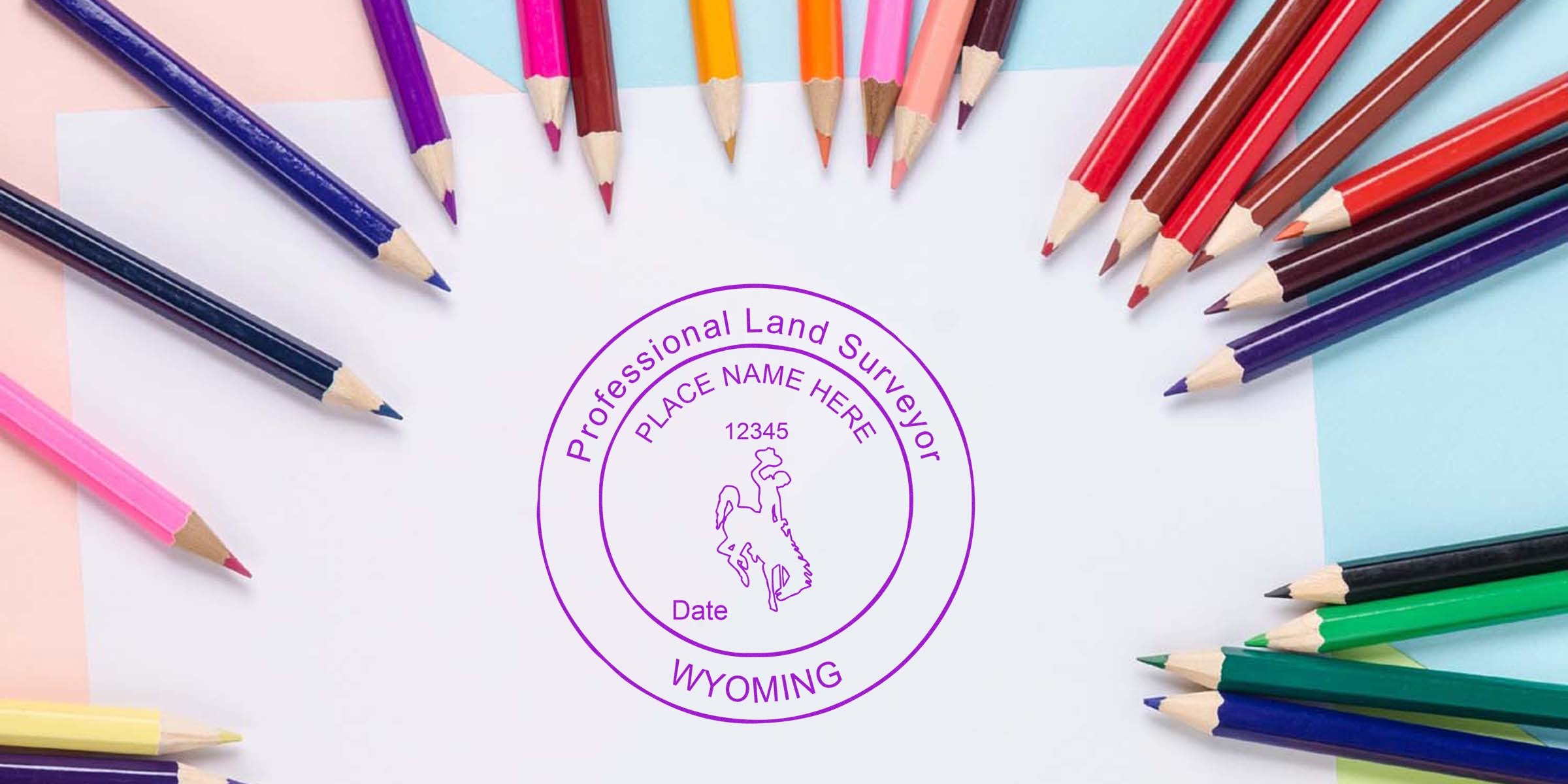 Wyoming land surveyor stamp on white paper, surrounded by colorful pencils, illustrating land surveyor stamp guidelines.