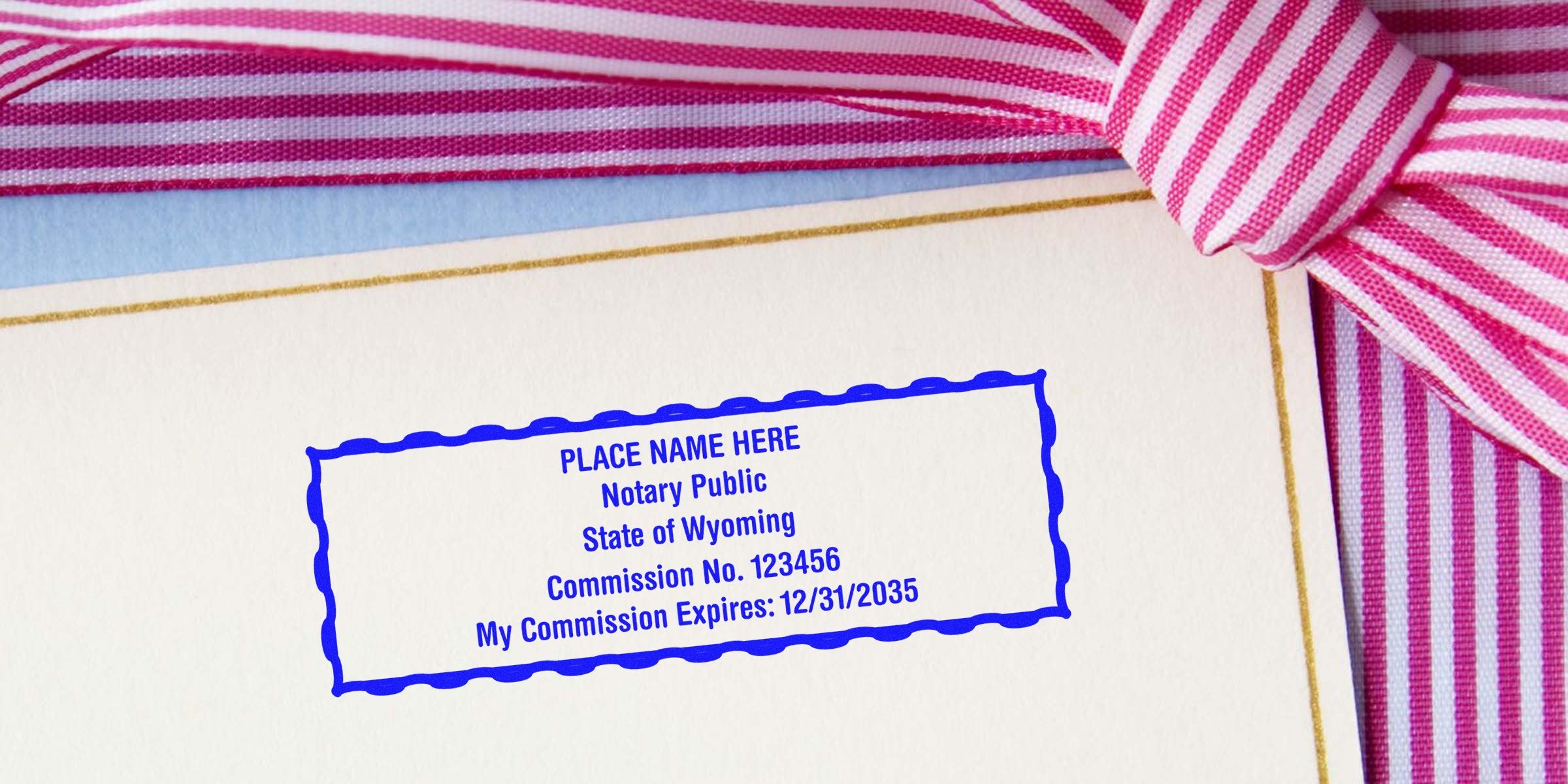 Wyoming notary public stamp on official document with pink striped ribbon, alongside Wyoming notary supplies and essentials.