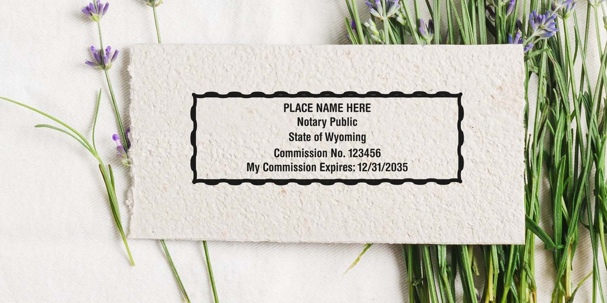 Wyoming notary stamp on textured paper with lavender flowers, showing official commission seal, expiration date, and sample stamp formats.