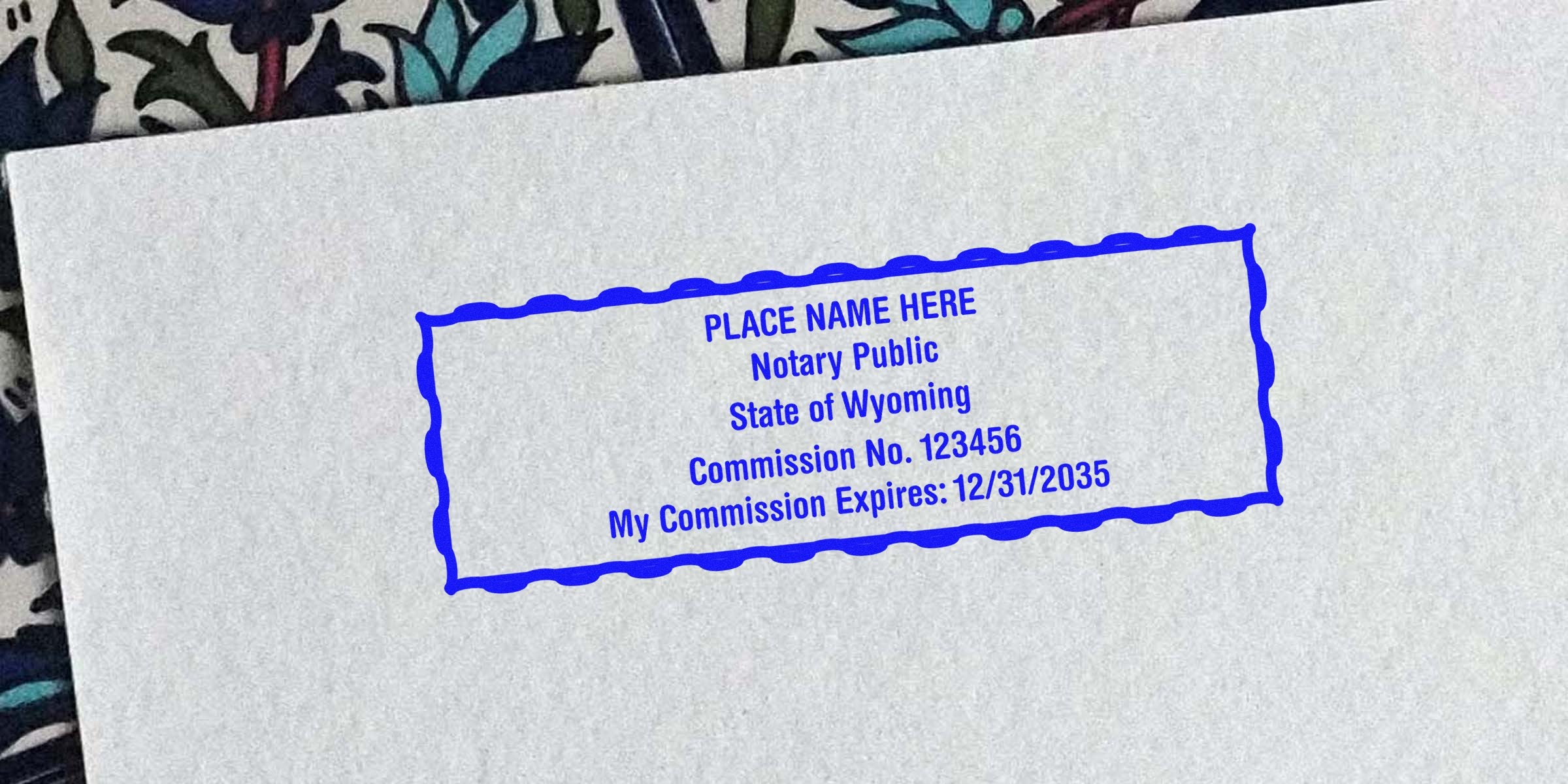 Custom Wyoming Notary Seals with commission number and expiration date stamped on paper.