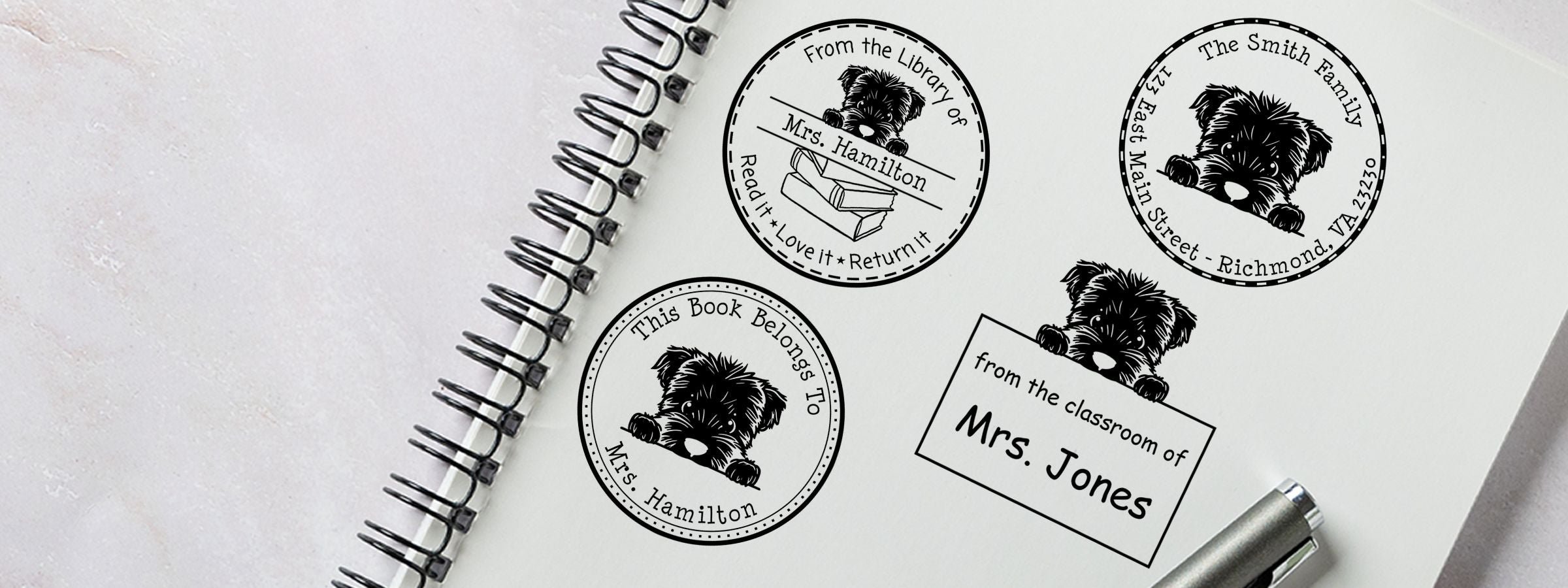 Bouvier Des Flandres Dog Stamps and Custom Seals: four black book stamps in a spiral notebook with a silver pen.