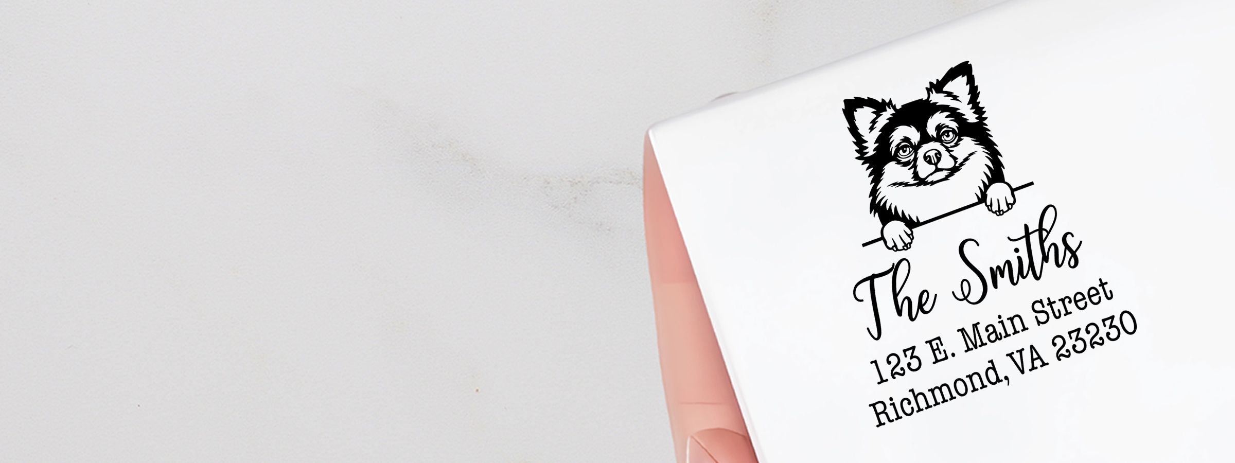 White envelope with black dog peeking over a line and The Smiths return address; Chihuahua Dog Stamps and Custom Seals.