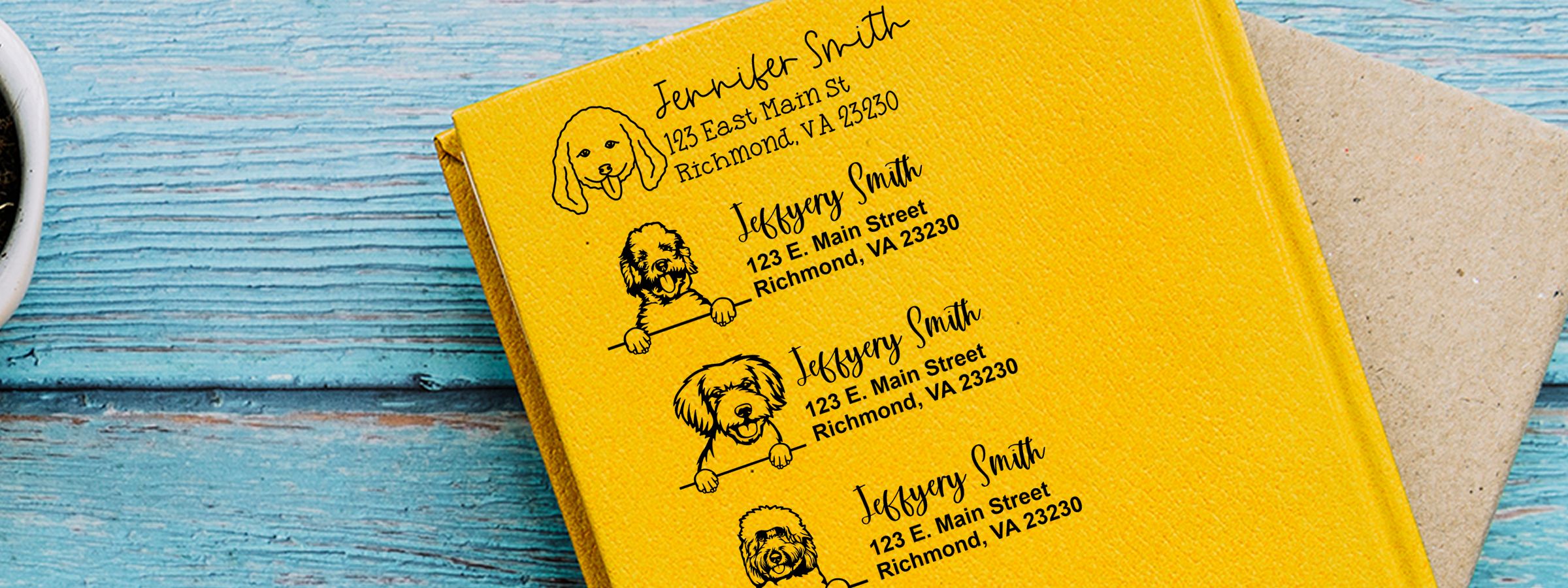 Bright yellow folder with personalized dog doodles and address labels on a blue wood background; Doodle Dog Stamps and Custom Seals.
