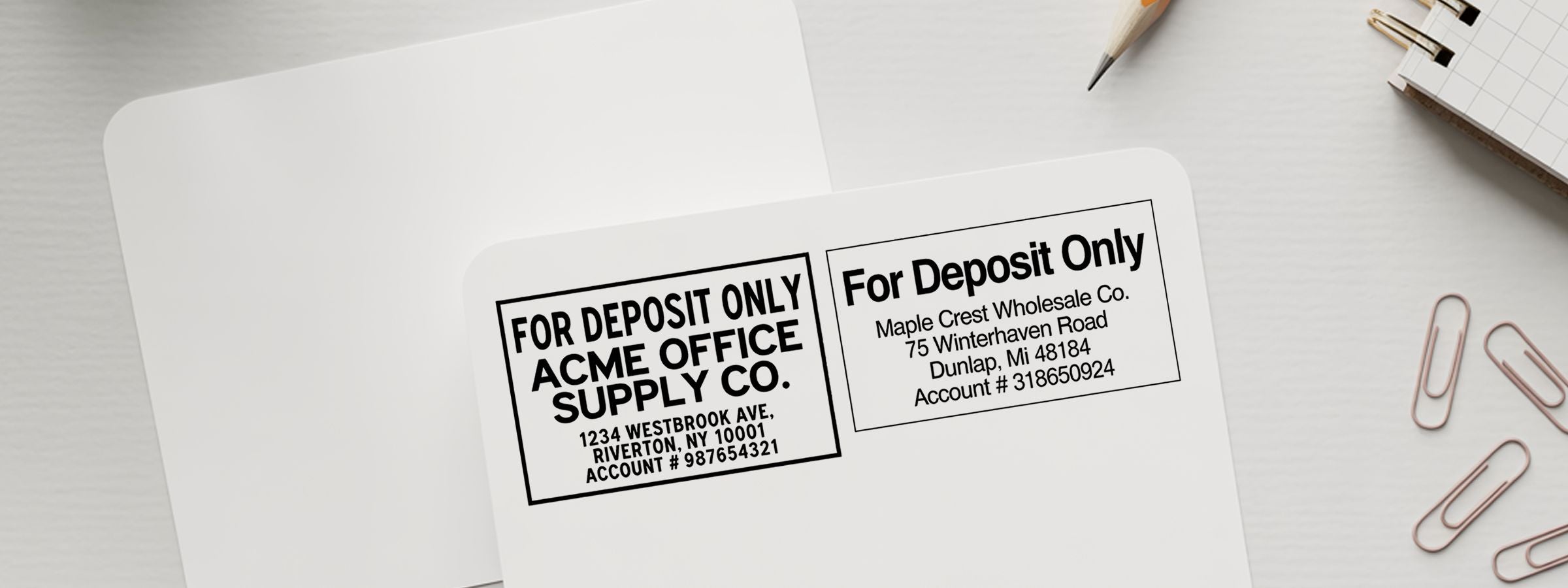 Envelope with Endorsement Stamps and For Deposit Only Stamps for Acme Office Supply Co. and Maple Crest Wholesale Co. on a desk.