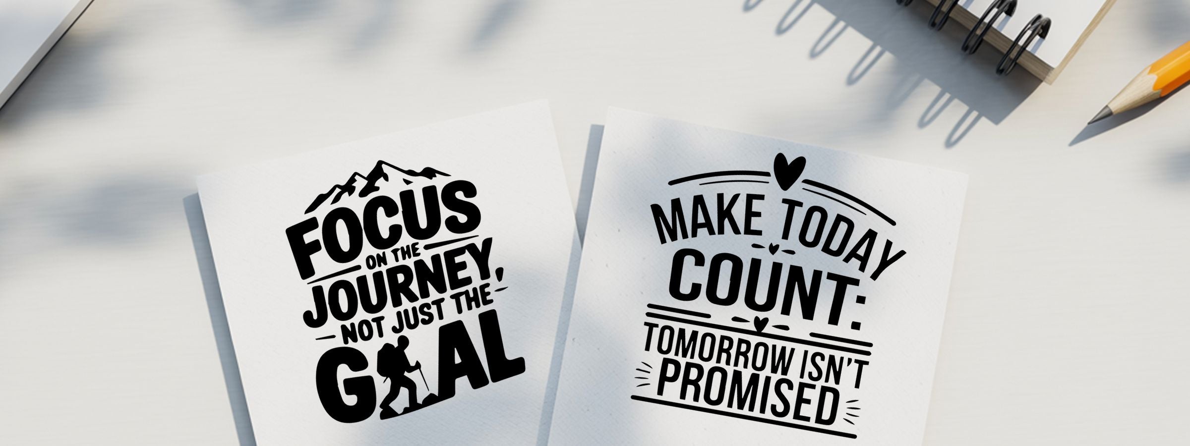 Entrepreneurship Craft Stamps on two white cards with motivational quotes, plus a pencil and notebook on a desk.