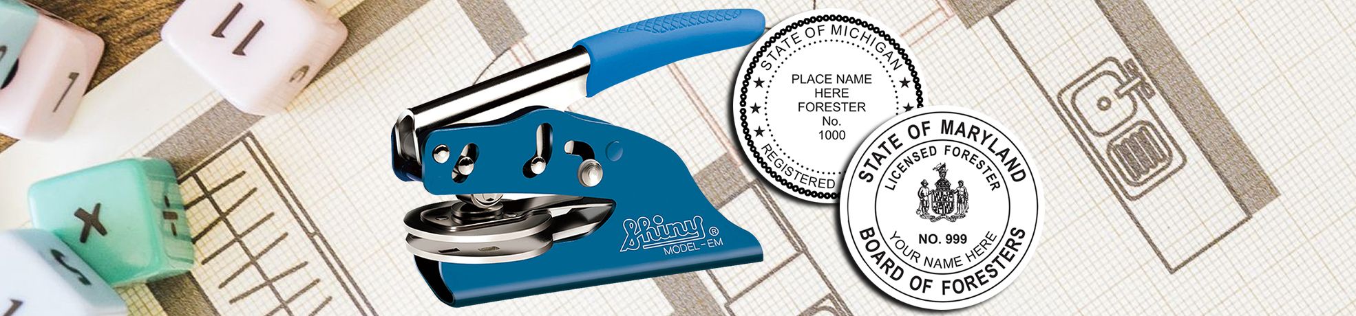 Blue handheld embossing stamp beside two forestry seal designs on a patterned calendar with dice blocks, Forester Stamps & Forester Seals.