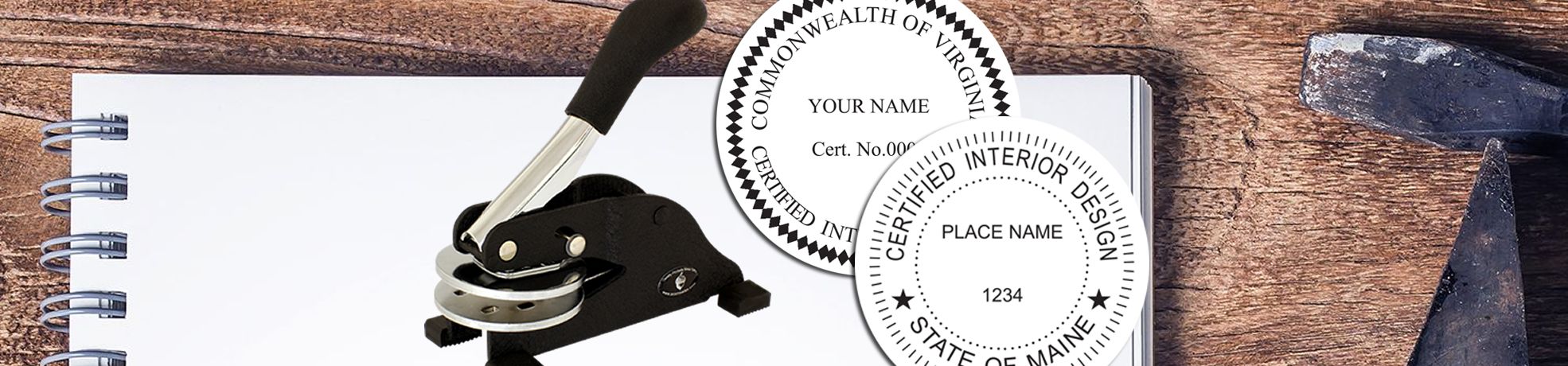 Notebook on a wooden table with seal press; Interior Designer Stamps & Interior Designer Seals, including Virginia and Certified Interior Design.