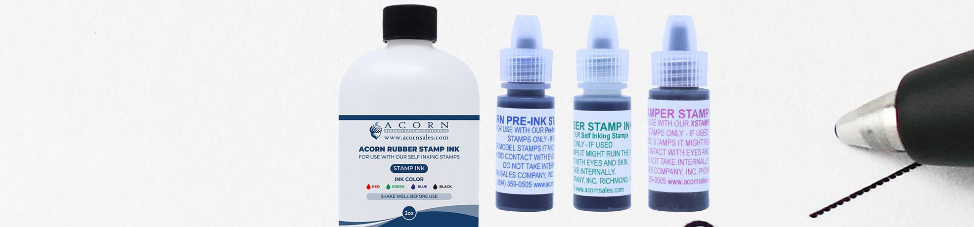 Assorted Rubber Stamp Inks bottles with a large bottle, three dropper bottles, and a rubber stamp tip on white background.