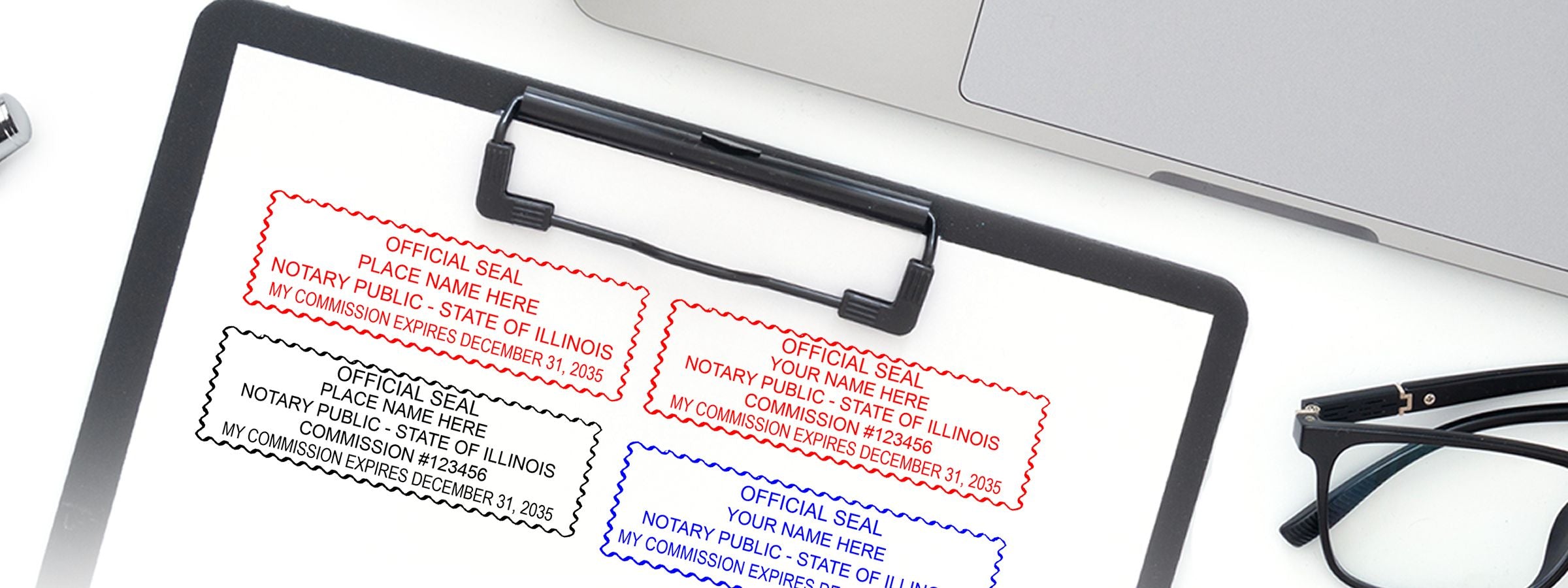 Top-down clipboard and laptop with glasses and four notary seal designs in red, black, and blue; Illinois Notary Supplies, Stamps and Seals.