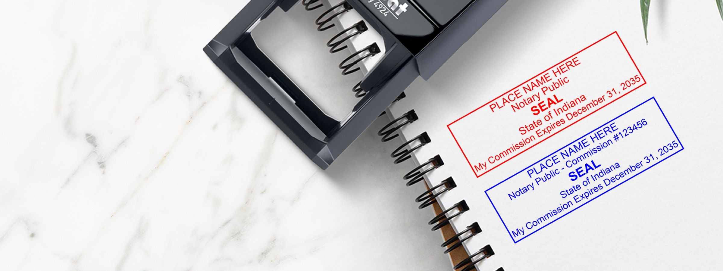 Black self-inking notary stamp on a spiral notebook with sample seal impressions, for Indiana Notary Supplies, Stamps and Seals.