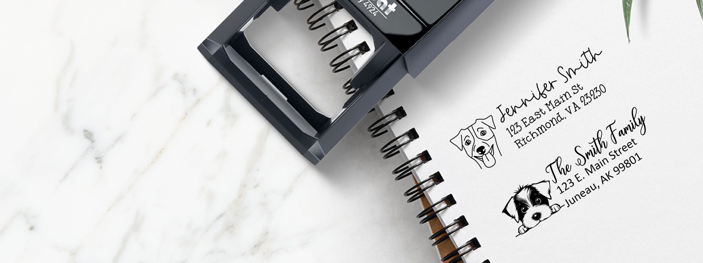 Black self-inking stamp on a spiral notebook page with Jack Russell Dog Stamps and Custom Seals, plus pet-themed return address designs.